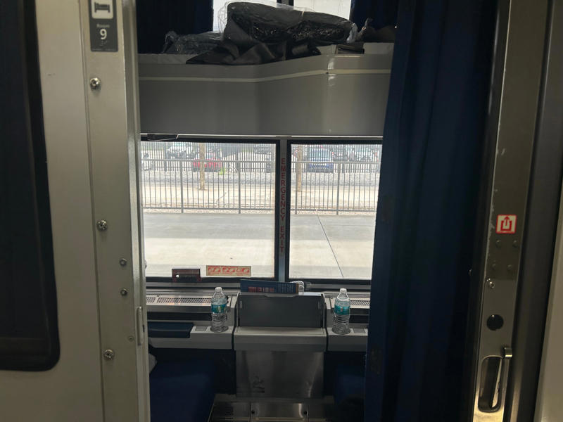 Unfortunately, my first-class journey began with a five-hour delay., Once my train finally arrived, I got to board early., A dedicated attendant guided me down the slim walkways to my room., The upper level featured a comfortable bed., The upper bed had its own storage space and viewing window., The dining car felt like a fine-dining experience ..., After a long day, the bed in the roomette was a godsend., Finally, I arrived at my destination six hours after the scheduled time.