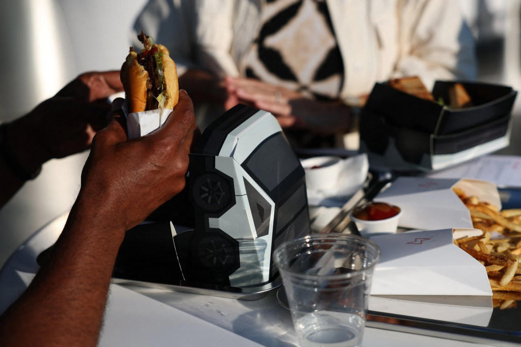 Inside Elon Musk’s Tesla diner where robots serve the food