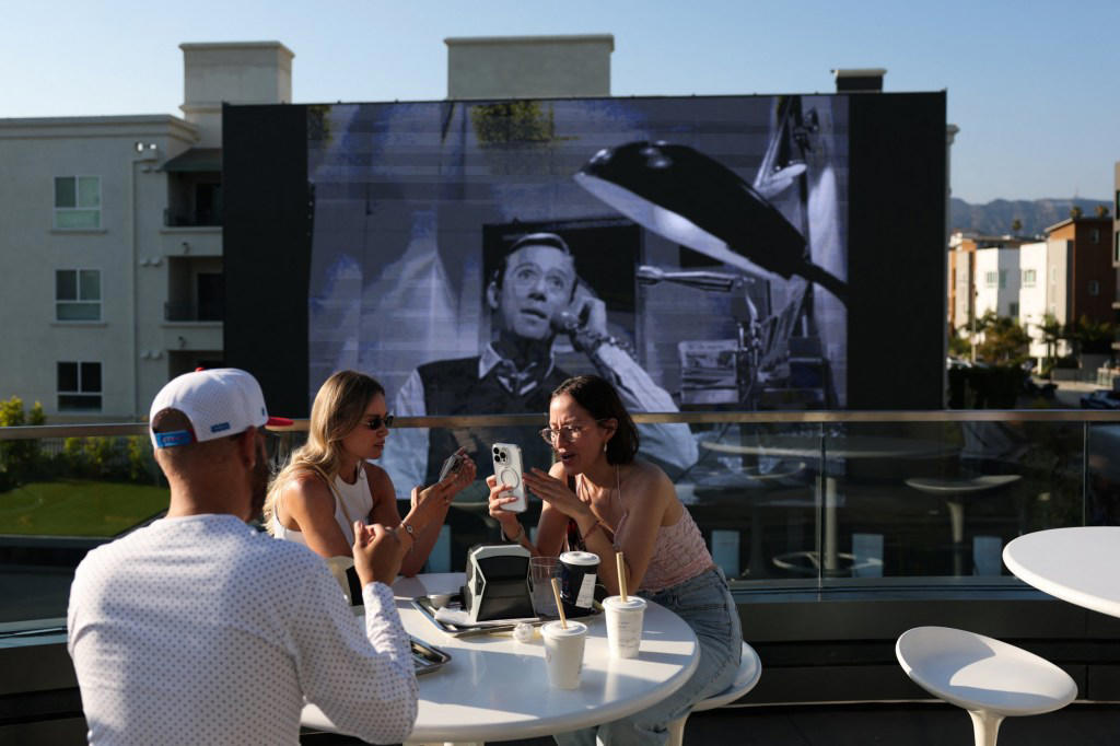 Inside Elon Musk’s Tesla diner where robots serve the food
