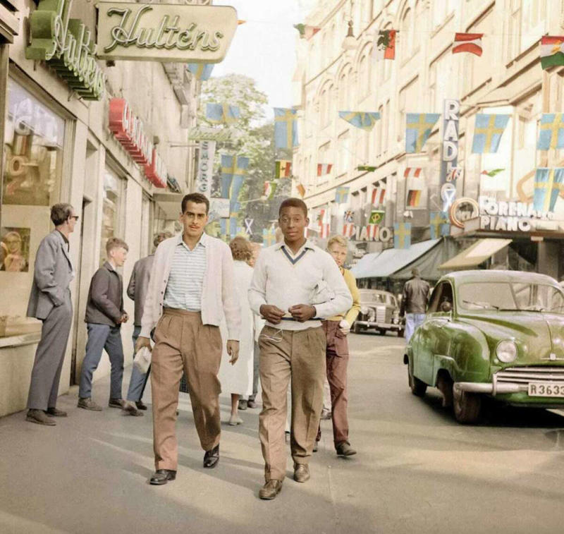 15. Pele, Sweden, 1958 1. Fans watching the new 1958 Los Angeles Dodgers, 2. A 1958 Chevrolet Imapala, 3. A solid Saturday afternoon matinee by the looks of it, circa 1958, 4. A couple young ladies waiting around in the benches, dressed their best, 1958, 5. Someone's family on a road trip, Kodachrome, 1958, 6. Scotch & Pretzels, 1958, 7. A proud owner of a new 1958 Oldsmobile, 8. A diner somewhere in America, 1958, 9. The Miami International Airport, 1958, 10. The front seat of a 1958 Buick, 11. Party at grandma's house, 1958, 12. Sellers of bread, Athens, Greece, 1958, 13. 1958, Oswego, New York, 14. A wonderful snapshot of the San Francisco street scene, 1958, 15. Pele, Sweden, 1958, 16. Canal Street, New Orleans, Louisiana, 1958, 17. Knott's Berry Farm, late 1950s, 18. A quick stop for breakfast for a long ole drive around, late 1950s, 19. Niagara Falls, 1958, 20. Dearborn, Michigan, Fire Department, 21. Kids playing ball in the street, 1958, 22. Christmastime in downtown Marion, Indiana, 1958, 23. A rainy day in Downtown, Indianapolis, Indiana, 24. Rochester, New York, 1958, 25. The Brussels International Airport, 1958, 26. People at the popular holiday resort of Capri, Italy, 1958, 27. A frosty day in February, 1958, 28. Listening to music in art class back in 1957, 29. Open-air schools in Netherlands in 1957, 30. Bill showing off his model aircraft collection in the late 1950s, 31. A high school football game in 1957, 32. Hanging out with a new car in a new subdivision, late 1950s, 33. A couple kids dreaming after grabbing a couple new toys in the late 1950s, 34. Getting dropped for naval flight training in 1957