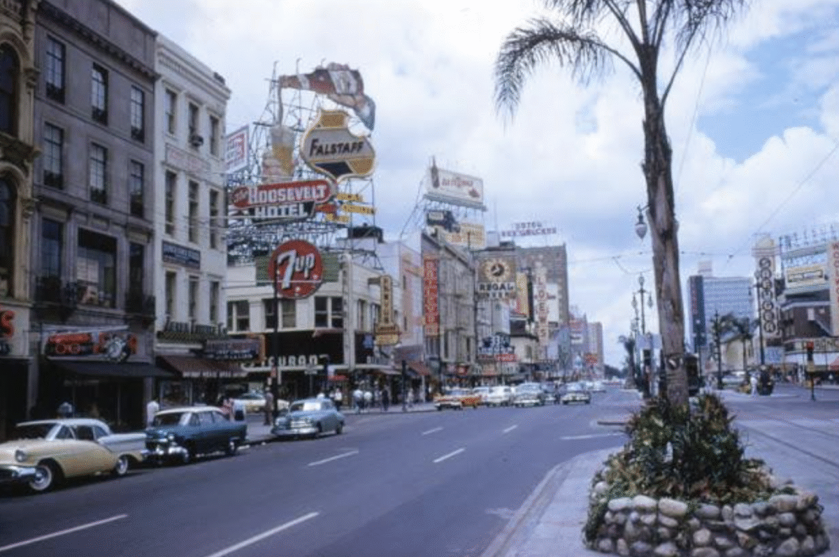 16. Canal Street, New Orleans, Louisiana, 1958 1. Fans watching the new 1958 Los Angeles Dodgers, 2. A 1958 Chevrolet Imapala, 3. A solid Saturday afternoon matinee by the looks of it, circa 1958, 4. A couple young ladies waiting around in the benches, dressed their best, 1958, 5. Someone's family on a road trip, Kodachrome, 1958, 6. Scotch & Pretzels, 1958, 7. A proud owner of a new 1958 Oldsmobile, 8. A diner somewhere in America, 1958, 9. The Miami International Airport, 1958, 10. The front seat of a 1958 Buick, 11. Party at grandma's house, 1958, 12. Sellers of bread, Athens, Greece, 1958, 13. 1958, Oswego, New York, 14. A wonderful snapshot of the San Francisco street scene, 1958, 15. Pele, Sweden, 1958, 16. Canal Street, New Orleans, Louisiana, 1958, 17. Knott's Berry Farm, late 1950s, 18. A quick stop for breakfast for a long ole drive around, late 1950s, 19. Niagara Falls, 1958, 20. Dearborn, Michigan, Fire Department, 21. Kids playing ball in the street, 1958, 22. Christmastime in downtown Marion, Indiana, 1958, 23. A rainy day in Downtown, Indianapolis, Indiana, 24. Rochester, New York, 1958, 25. The Brussels International Airport, 1958, 26. People at the popular holiday resort of Capri, Italy, 1958, 27. A frosty day in February, 1958, 28. Listening to music in art class back in 1957, 29. Open-air schools in Netherlands in 1957, 30. Bill showing off his model aircraft collection in the late 1950s, 31. A high school football game in 1957, 32. Hanging out with a new car in a new subdivision, late 1950s, 33. A couple kids dreaming after grabbing a couple new toys in the late 1950s, 34. Getting dropped for naval flight training in 1957