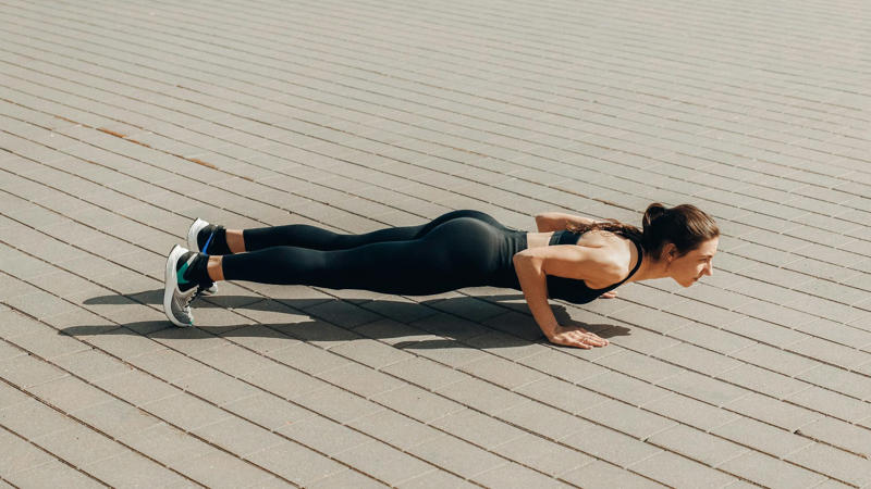 1. Push-Ups, 2. Squats, 3. Planks, 4. Lunges, 5. Glute Bridges, 6. Wall Sits, 7. Triceps Dips, 8. Mountain Climbers, 9. Burpees, 10. High Knees, 11. Superman Hold, 12. Hollow Body Hold, 13. Wall Angels, 14. Bear Crawls, 15. Step-Ups, 16. Crab Walks, 17. Wall Walks, 18. Skater Hops, 19. Donkey Kicks, 20. Inchworms