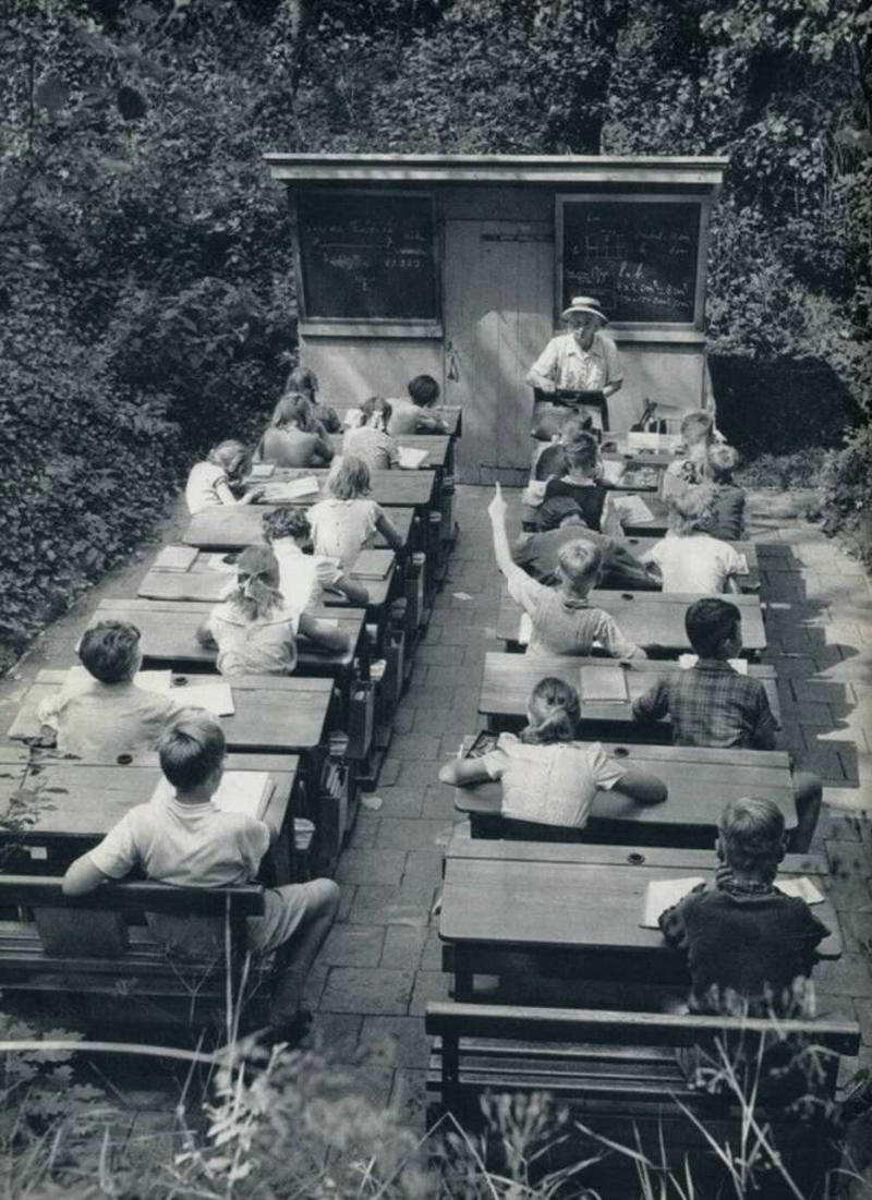 29. Open-air schools in Netherlands in 1957 1. Fans watching the new 1958 Los Angeles Dodgers, 2. A 1958 Chevrolet Imapala, 3. A solid Saturday afternoon matinee by the looks of it, circa 1958, 4. A couple young ladies waiting around in the benches, dressed their best, 1958, 5. Someone's family on a road trip, Kodachrome, 1958, 6. Scotch & Pretzels, 1958, 7. A proud owner of a new 1958 Oldsmobile, 8. A diner somewhere in America, 1958, 9. The Miami International Airport, 1958, 10. The front seat of a 1958 Buick, 11. Party at grandma's house, 1958, 12. Sellers of bread, Athens, Greece, 1958, 13. 1958, Oswego, New York, 14. A wonderful snapshot of the San Francisco street scene, 1958, 15. Pele, Sweden, 1958, 16. Canal Street, New Orleans, Louisiana, 1958, 17. Knott's Berry Farm, late 1950s, 18. A quick stop for breakfast for a long ole drive around, late 1950s, 19. Niagara Falls, 1958, 20. Dearborn, Michigan, Fire Department, 21. Kids playing ball in the street, 1958, 22. Christmastime in downtown Marion, Indiana, 1958, 23. A rainy day in Downtown, Indianapolis, Indiana, 24. Rochester, New York, 1958, 25. The Brussels International Airport, 1958, 26. People at the popular holiday resort of Capri, Italy, 1958, 27. A frosty day in February, 1958, 28. Listening to music in art class back in 1957, 29. Open-air schools in Netherlands in 1957, 30. Bill showing off his model aircraft collection in the late 1950s, 31. A high school football game in 1957, 32. Hanging out with a new car in a new subdivision, late 1950s, 33. A couple kids dreaming after grabbing a couple new toys in the late 1950s, 34. Getting dropped for naval flight training in 1957