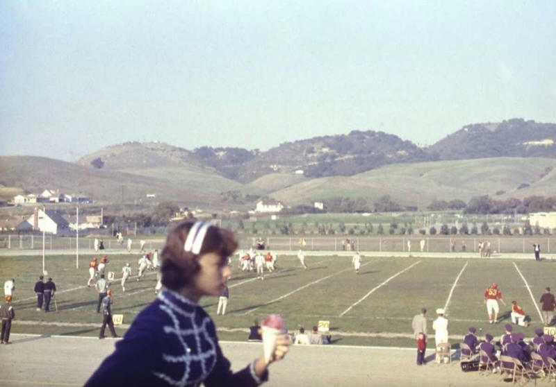 31. A high school football game in 1957 1. Fans watching the new 1958 Los Angeles Dodgers, 2. A 1958 Chevrolet Imapala, 3. A solid Saturday afternoon matinee by the looks of it, circa 1958, 4. A couple young ladies waiting around in the benches, dressed their best, 1958, 5. Someone's family on a road trip, Kodachrome, 1958, 6. Scotch & Pretzels, 1958, 7. A proud owner of a new 1958 Oldsmobile, 8. A diner somewhere in America, 1958, 9. The Miami International Airport, 1958, 10. The front seat of a 1958 Buick, 11. Party at grandma's house, 1958, 12. Sellers of bread, Athens, Greece, 1958, 13. 1958, Oswego, New York, 14. A wonderful snapshot of the San Francisco street scene, 1958, 15. Pele, Sweden, 1958, 16. Canal Street, New Orleans, Louisiana, 1958, 17. Knott's Berry Farm, late 1950s, 18. A quick stop for breakfast for a long ole drive around, late 1950s, 19. Niagara Falls, 1958, 20. Dearborn, Michigan, Fire Department, 21. Kids playing ball in the street, 1958, 22. Christmastime in downtown Marion, Indiana, 1958, 23. A rainy day in Downtown, Indianapolis, Indiana, 24. Rochester, New York, 1958, 25. The Brussels International Airport, 1958, 26. People at the popular holiday resort of Capri, Italy, 1958, 27. A frosty day in February, 1958, 28. Listening to music in art class back in 1957, 29. Open-air schools in Netherlands in 1957, 30. Bill showing off his model aircraft collection in the late 1950s, 31. A high school football game in 1957, 32. Hanging out with a new car in a new subdivision, late 1950s, 33. A couple kids dreaming after grabbing a couple new toys in the late 1950s, 34. Getting dropped for naval flight training in 1957