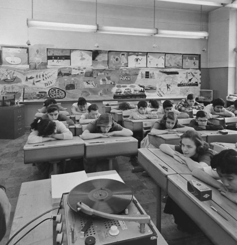 28. Listening to music in art class back in 1957 1. Fans watching the new 1958 Los Angeles Dodgers, 2. A 1958 Chevrolet Imapala, 3. A solid Saturday afternoon matinee by the looks of it, circa 1958, 4. A couple young ladies waiting around in the benches, dressed their best, 1958, 5. Someone's family on a road trip, Kodachrome, 1958, 6. Scotch & Pretzels, 1958, 7. A proud owner of a new 1958 Oldsmobile, 8. A diner somewhere in America, 1958, 9. The Miami International Airport, 1958, 10. The front seat of a 1958 Buick, 11. Party at grandma's house, 1958, 12. Sellers of bread, Athens, Greece, 1958, 13. 1958, Oswego, New York, 14. A wonderful snapshot of the San Francisco street scene, 1958, 15. Pele, Sweden, 1958, 16. Canal Street, New Orleans, Louisiana, 1958, 17. Knott's Berry Farm, late 1950s, 18. A quick stop for breakfast for a long ole drive around, late 1950s, 19. Niagara Falls, 1958, 20. Dearborn, Michigan, Fire Department, 21. Kids playing ball in the street, 1958, 22. Christmastime in downtown Marion, Indiana, 1958, 23. A rainy day in Downtown, Indianapolis, Indiana, 24. Rochester, New York, 1958, 25. The Brussels International Airport, 1958, 26. People at the popular holiday resort of Capri, Italy, 1958, 27. A frosty day in February, 1958, 28. Listening to music in art class back in 1957, 29. Open-air schools in Netherlands in 1957, 30. Bill showing off his model aircraft collection in the late 1950s, 31. A high school football game in 1957, 32. Hanging out with a new car in a new subdivision, late 1950s, 33. A couple kids dreaming after grabbing a couple new toys in the late 1950s, 34. Getting dropped for naval flight training in 1957