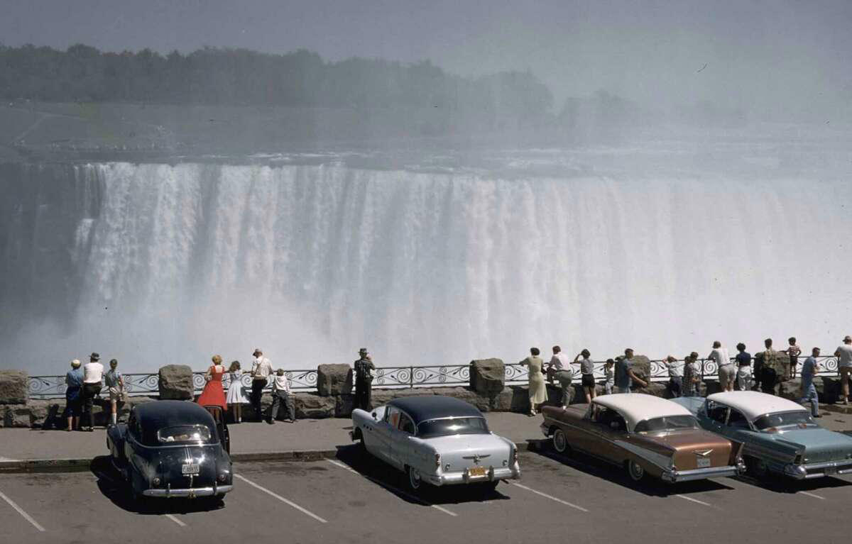 19. Niagara Falls, 1958 1. Fans watching the new 1958 Los Angeles Dodgers, 2. A 1958 Chevrolet Imapala, 3. A solid Saturday afternoon matinee by the looks of it, circa 1958, 4. A couple young ladies waiting around in the benches, dressed their best, 1958, 5. Someone's family on a road trip, Kodachrome, 1958, 6. Scotch & Pretzels, 1958, 7. A proud owner of a new 1958 Oldsmobile, 8. A diner somewhere in America, 1958, 9. The Miami International Airport, 1958, 10. The front seat of a 1958 Buick, 11. Party at grandma's house, 1958, 12. Sellers of bread, Athens, Greece, 1958, 13. 1958, Oswego, New York, 14. A wonderful snapshot of the San Francisco street scene, 1958, 15. Pele, Sweden, 1958, 16. Canal Street, New Orleans, Louisiana, 1958, 17. Knott's Berry Farm, late 1950s, 18. A quick stop for breakfast for a long ole drive around, late 1950s, 19. Niagara Falls, 1958, 20. Dearborn, Michigan, Fire Department, 21. Kids playing ball in the street, 1958, 22. Christmastime in downtown Marion, Indiana, 1958, 23. A rainy day in Downtown, Indianapolis, Indiana, 24. Rochester, New York, 1958, 25. The Brussels International Airport, 1958, 26. People at the popular holiday resort of Capri, Italy, 1958, 27. A frosty day in February, 1958, 28. Listening to music in art class back in 1957, 29. Open-air schools in Netherlands in 1957, 30. Bill showing off his model aircraft collection in the late 1950s, 31. A high school football game in 1957, 32. Hanging out with a new car in a new subdivision, late 1950s, 33. A couple kids dreaming after grabbing a couple new toys in the late 1950s, 34. Getting dropped for naval flight training in 1957