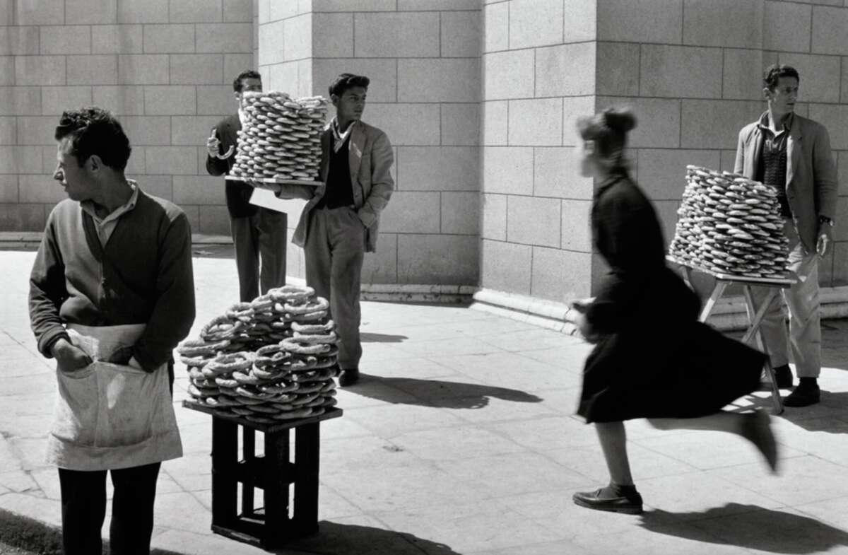 12. Sellers of bread, Athens, Greece, 1958 1. Fans watching the new 1958 Los Angeles Dodgers, 2. A 1958 Chevrolet Imapala, 3. A solid Saturday afternoon matinee by the looks of it, circa 1958, 4. A couple young ladies waiting around in the benches, dressed their best, 1958, 5. Someone's family on a road trip, Kodachrome, 1958, 6. Scotch & Pretzels, 1958, 7. A proud owner of a new 1958 Oldsmobile, 8. A diner somewhere in America, 1958, 9. The Miami International Airport, 1958, 10. The front seat of a 1958 Buick, 11. Party at grandma's house, 1958, 12. Sellers of bread, Athens, Greece, 1958, 13. 1958, Oswego, New York, 14. A wonderful snapshot of the San Francisco street scene, 1958, 15. Pele, Sweden, 1958, 16. Canal Street, New Orleans, Louisiana, 1958, 17. Knott's Berry Farm, late 1950s, 18. A quick stop for breakfast for a long ole drive around, late 1950s, 19. Niagara Falls, 1958, 20. Dearborn, Michigan, Fire Department, 21. Kids playing ball in the street, 1958, 22. Christmastime in downtown Marion, Indiana, 1958, 23. A rainy day in Downtown, Indianapolis, Indiana, 24. Rochester, New York, 1958, 25. The Brussels International Airport, 1958, 26. People at the popular holiday resort of Capri, Italy, 1958, 27. A frosty day in February, 1958, 28. Listening to music in art class back in 1957, 29. Open-air schools in Netherlands in 1957, 30. Bill showing off his model aircraft collection in the late 1950s, 31. A high school football game in 1957, 32. Hanging out with a new car in a new subdivision, late 1950s, 33. A couple kids dreaming after grabbing a couple new toys in the late 1950s, 34. Getting dropped for naval flight training in 1957