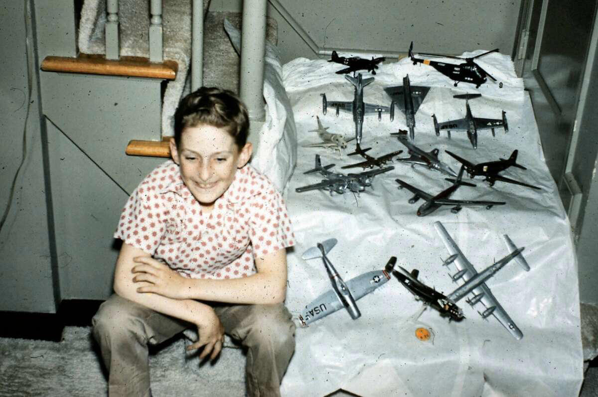 30. Bill showing off his model aircraft collection in the late 1950s 1. Fans watching the new 1958 Los Angeles Dodgers, 2. A 1958 Chevrolet Imapala, 3. A solid Saturday afternoon matinee by the looks of it, circa 1958, 4. A couple young ladies waiting around in the benches, dressed their best, 1958, 5. Someone's family on a road trip, Kodachrome, 1958, 6. Scotch & Pretzels, 1958, 7. A proud owner of a new 1958 Oldsmobile, 8. A diner somewhere in America, 1958, 9. The Miami International Airport, 1958, 10. The front seat of a 1958 Buick, 11. Party at grandma's house, 1958, 12. Sellers of bread, Athens, Greece, 1958, 13. 1958, Oswego, New York, 14. A wonderful snapshot of the San Francisco street scene, 1958, 15. Pele, Sweden, 1958, 16. Canal Street, New Orleans, Louisiana, 1958, 17. Knott's Berry Farm, late 1950s, 18. A quick stop for breakfast for a long ole drive around, late 1950s, 19. Niagara Falls, 1958, 20. Dearborn, Michigan, Fire Department, 21. Kids playing ball in the street, 1958, 22. Christmastime in downtown Marion, Indiana, 1958, 23. A rainy day in Downtown, Indianapolis, Indiana, 24. Rochester, New York, 1958, 25. The Brussels International Airport, 1958, 26. People at the popular holiday resort of Capri, Italy, 1958, 27. A frosty day in February, 1958, 28. Listening to music in art class back in 1957, 29. Open-air schools in Netherlands in 1957, 30. Bill showing off his model aircraft collection in the late 1950s, 31. A high school football game in 1957, 32. Hanging out with a new car in a new subdivision, late 1950s, 33. A couple kids dreaming after grabbing a couple new toys in the late 1950s, 34. Getting dropped for naval flight training in 1957