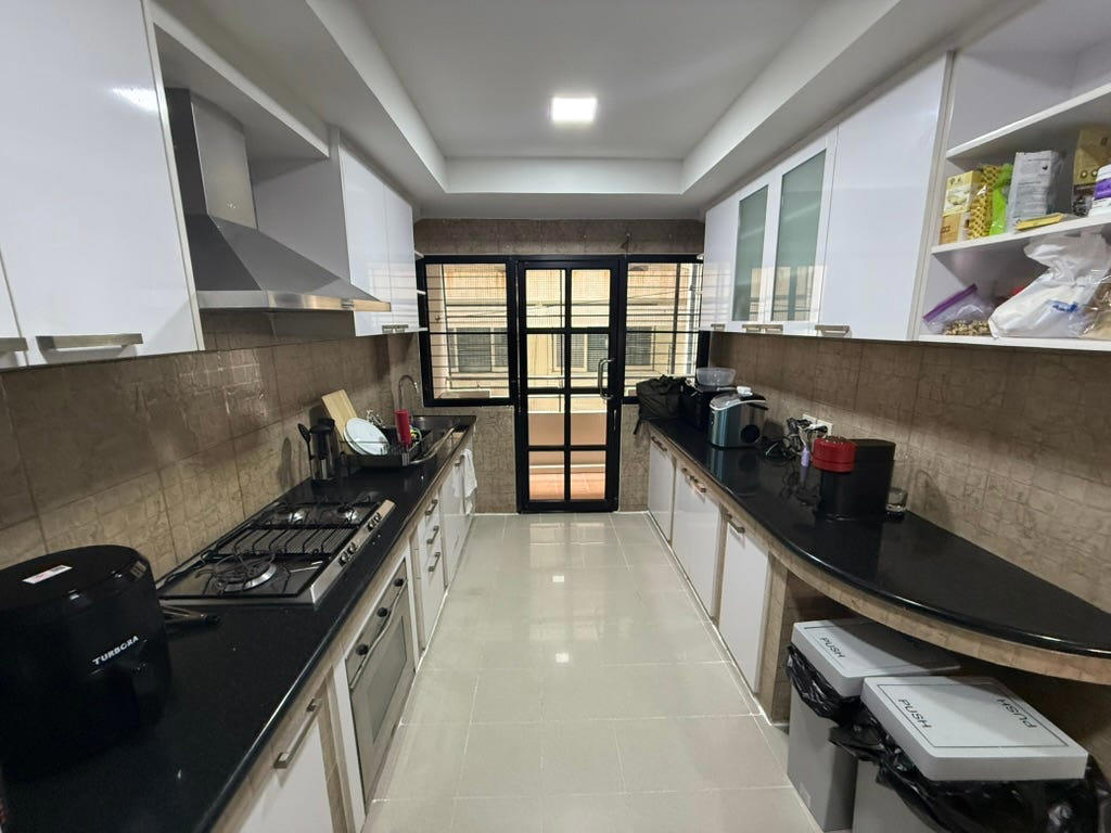 There is a nice-sized kitchen with a balcony — which houses our washer and dryer.