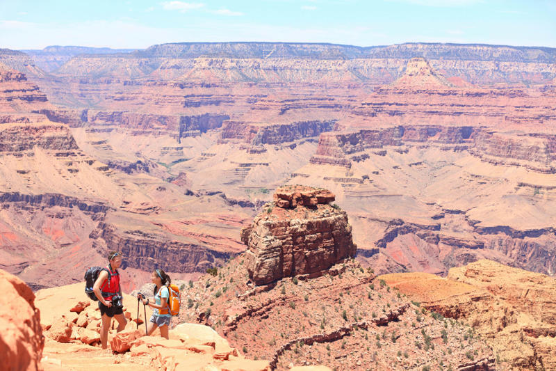 1. Ride the train to the South Rim via Grand Canyon Railway, 2. Absorb the canyon’s majesty from several viewpoints, 3. Admire landscape-inspired art at Kolb Studio, 4. Take a hike along Bright Angel Trail or South Kaibab Trail, 5. Check into Phantom Ranch or another woodsy in-park lodge, 6. Kayak curvy Horseshoe Bend, 7. Go white-water rafting on the Colorado River, 8. Take in layered vistas with a bike ride along the South Rim Trail, 9. Don’t forget a North Rim excursion, 10. Explore the East Entrance and Desert View Watchtower, 11. Admire the view from Roosevelt Point, 12. Embark on a mule trip to the bottom of the canyon, 13. Visit the Trail of Time for a geologic journey, 14. Tour the East Cabin at Pipe Spring National Monument, 15. Marvel at the night sky, 16. Step back in time at Bright Angel Lodge, 17. Walk the edge of the Skywalk, 18. Soar high on a scenic helicopter tour