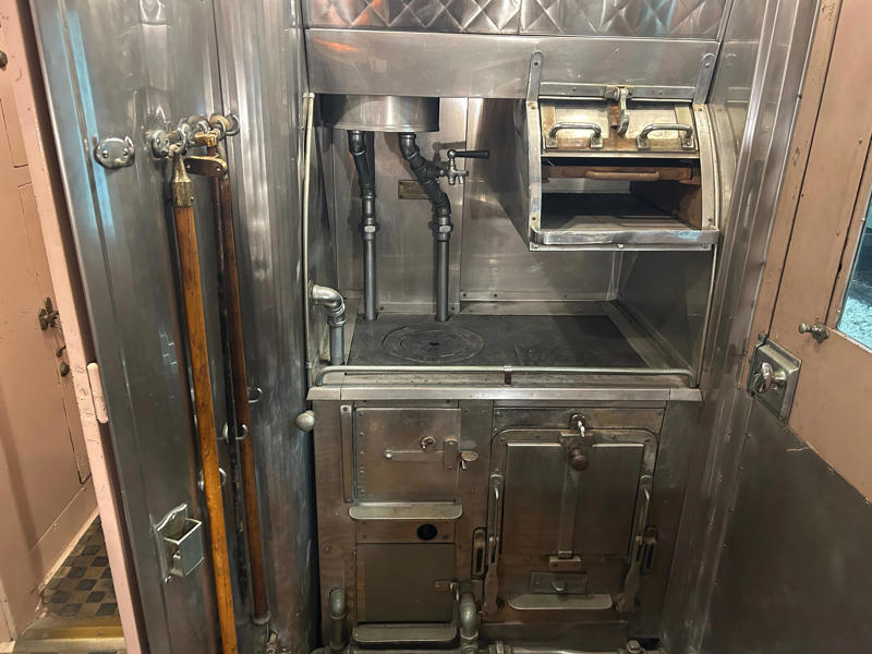 In the kitchen, an onboard chef had access to ovens and refrigerators. To carry the president, the unique armored car had enhanced security features., In the kitchen, an onboard chef had access to ovens and refrigerators., The car housed two staff members: a chef and a porter., The car included two guest bedrooms along with a presidential suite., The presidential suite included the president's sleeping area., The first lady's room was located parallel to the president's., A narrow hallway led from the staterooms to the observation deck., The observation lounge featured some of the presidential car's original furniture., During the refurbishment, a submarine escape hatch was added to the car.