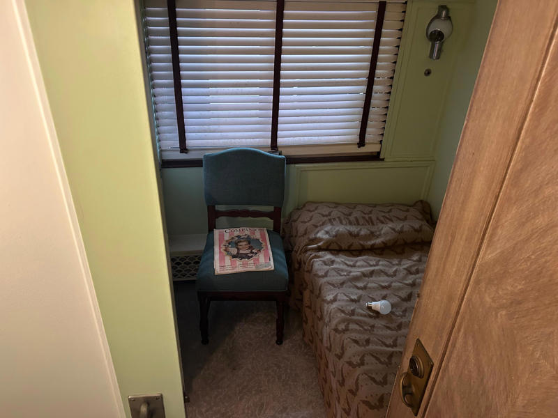 The first lady's room paralleled the president's. To carry the president, the unique armored car had enhanced security features., In the kitchen, an onboard chef had access to ovens and refrigerators., The car housed two staff members: a chef and a porter., The car included two guest bedrooms along with a presidential suite., The presidential suite included the president's sleeping area., The first lady's room was located parallel to the president's., A narrow hallway led from the staterooms to the observation deck., The observation lounge featured some of the presidential car's original furniture., During the refurbishment, a submarine escape hatch was added to the car.