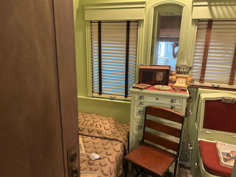 The presidential suite included the president's sleeping area. To carry the president, the unique armored car had enhanced security features., In the kitchen, an onboard chef had access to ovens and refrigerators., The car housed two staff members: a chef and a porter., The car included two guest bedrooms along with a presidential suite., The presidential suite included the president's sleeping area., The first lady's room was located parallel to the president's., A narrow hallway led from the staterooms to the observation deck., The observation lounge featured some of the presidential car's original furniture., During the refurbishment, a submarine escape hatch was added to the car.