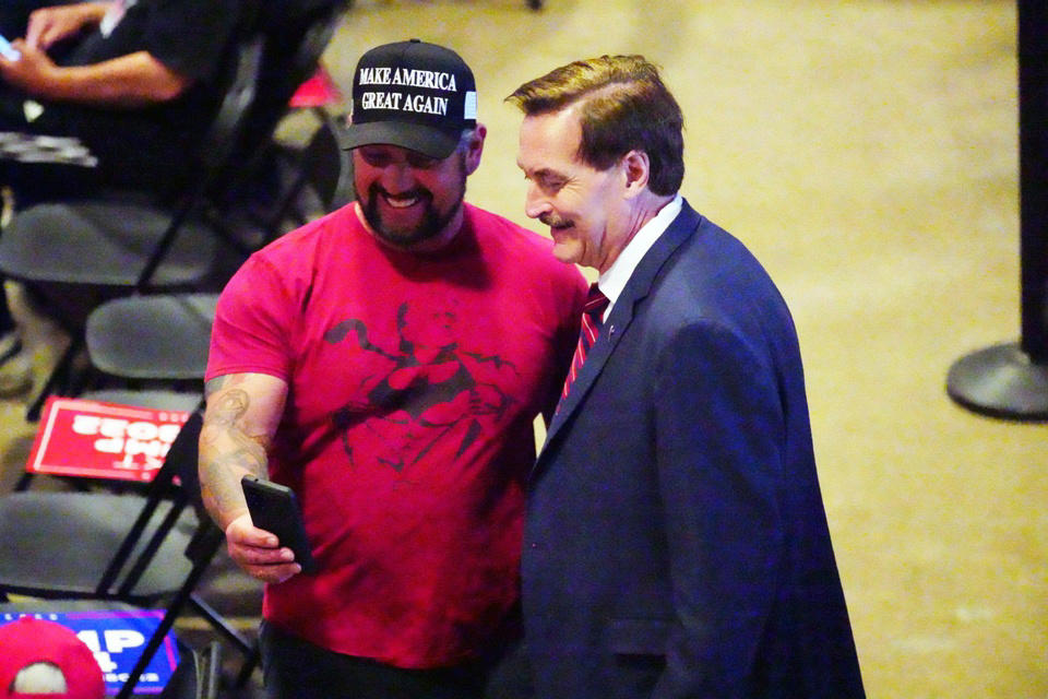 Mike Lindell poses with fan at Trump rally Mike Lindell at CPAC 2024 in National Harbor, Mike Lindell at CPAC 2023 conference, Mike Lindell speaks at Trump rally in Mesa, Mike Lindell poses with fan at Trump rally, Denise Hunt prays for Mike Lindell at rally, Mike Lindell at Trump’s gala in Palm Beach, Linda Rantz and Andy Palecek discuss election security, Mike Lindell greets Trump supporters in Palm Beach