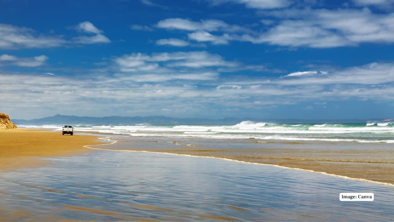 1. Praia do Cassino Beach, Brazil – 158 miles Claiming the title of the world’s longest beach, Praia do Cassino extends over 158 miles along Brazil’s southern coast. This unbroken stretch of sand is largely untouched, offering visitors vast spaces for beachcombing, fishing, and wildlife spotting, including migrating whales and dolphins. (Representative Image: Canva), 2. Ninety Mile Beach, Australia – 95 miles Despite its name, this spectacular beach in Victoria measures approximately 95 miles. Known for its sweeping sandy dunes and gentle surf, Ninety Mile Beach offers an escape for campers, fishermen, and nature enthusiasts seeking uninterrupted coastal wilderness. (Image: Parks Victoria), 3. Cox’s Bazar Beach, Bangladesh – 75 miles Cox’s Bazar is not only the longest natural sea beach in Bangladesh but also one of the most popular tourist destinations in South Asia. Stretching 75 miles along the Bay of Bengal, it boasts golden sands, picturesque sunsets, and vibrant local markets. (Image: Canva), 4. Padre Island National Seashore, USA – 70 miles Located in Texas, Padre Island National Seashore protects 70 miles of undeveloped barrier island coastline. Visitors can enjoy pristine beaches, birdwatching, and the rare sight of sea turtle nesting sites, making it a haven for nature lovers and eco-tourists. (Image: Canva), 5. Ninety Mile Beach, New Zealand – 55 miles This northern New Zealand beach is famous for its vast length and unique driving experience along the sand. Beyond its name, the beach stretches about 55 miles and offers beautiful views of the Tasman Sea and native dune forests. (Image: Canva), 6. Playa Novillero, Mexico – 51 miles Playa Novillero, located on Mexico’s Pacific coast, is one of the longest uninterrupted beaches in the country. Its gentle waves and calm waters make it an ideal spot for swimming, fishing, and traditional beachside relaxation. (Image: X/@jlgraro), 7. Virginia Beach, United States – 35 miles Virginia Beach is a vibrant coastal city with 35 miles of sandy shores. Known for its lively boardwalk, family-friendly atmosphere, and annual events, it combines urban amenities with a classic beach experience. (Image: Canva), 8. Muizenberg Beach, South Africa – 25 miles Located near Cape Town, Muizenberg Beach stretches for 25 miles and is famous for its colorful beach huts and excellent surfing conditions. It attracts both locals and tourists for swimming, surfing, and coastal walks. (Image: Canva), 9. Stockton Beach, Australia – 20 miles Stockton Beach in New South Wales offers 20 miles of sandy expanse ideal for four-wheel driving, fishing, and sand dune exploration. Its dynamic landscape of shifting dunes and tidal pools is a playground for adventure seekers. (Image: Canva), 10. Long Beach, Canada – 10 miles Nestled in British Columbia’s Pacific Rim National Park, Long Beach offers 10 miles of wild, windswept shorelines. Its dramatic coastal views and excellent surfing opportunities make it one of Canada’s most beloved beaches. (Image: Canva)