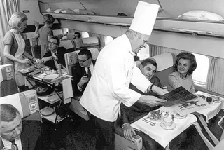 Beef Wellington at 30,000 feet. Welcome to the golden age of flying!, The sky and cocktail lounge era., Not just a plane, it was a flying party lounge., This Japan Airlines cabin looked like a flying art gallery., Seems like flying was basically a deli dream., Groove was in the skies., Cocktail hour in the clouds was a must., Airline lounges? More like a Bond movie set., When the in-flight meal came with real plates., Sipping and playing cards. Pure bliss., Back when everyone had lounge access., No baggage fees, just smiles and drinks., Conversation pods for a cruising altitude., Studio 54 with some light turbulence., First class or a retro nightclub?, Beef Wellington at 30,000 feet., No turbulence, just a toast in the aisle., Fresh fruit? Yes, please.