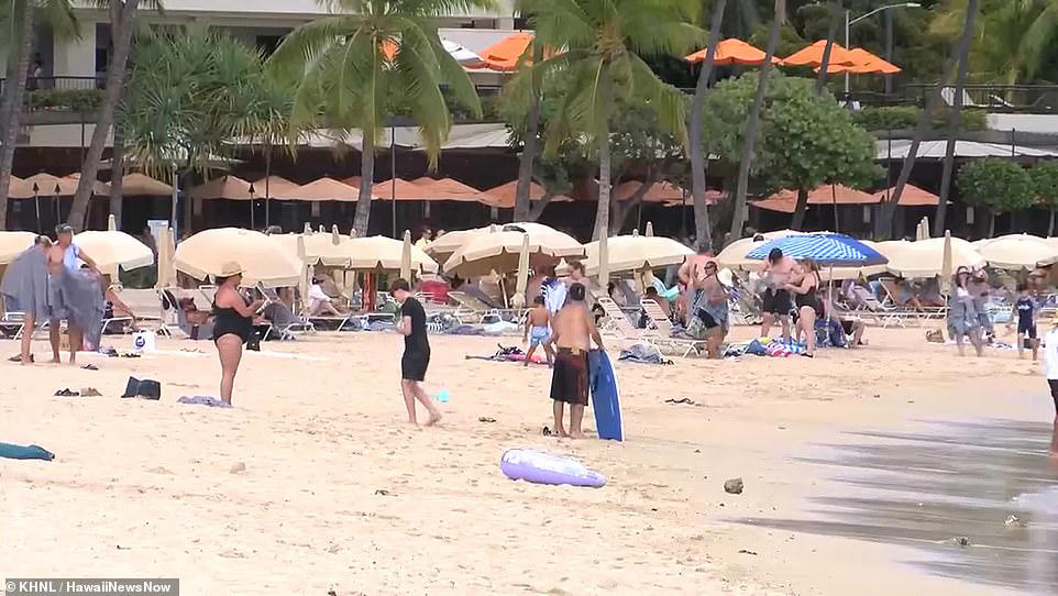 Swimmers ignore tsunami warning on Hawaii's Waikiki Beach