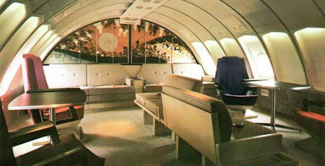 First class or a retro nightclub? Welcome to the golden age of flying!, The sky and cocktail lounge era., Not just a plane, it was a flying party lounge., This Japan Airlines cabin looked like a flying art gallery., Seems like flying was basically a deli dream., Groove was in the skies., Cocktail hour in the clouds was a must., Airline lounges? More like a Bond movie set., When the in-flight meal came with real plates., Sipping and playing cards. Pure bliss., Back when everyone had lounge access., No baggage fees, just smiles and drinks., Conversation pods for a cruising altitude., Studio 54 with some light turbulence., First class or a retro nightclub?, Beef Wellington at 30,000 feet., No turbulence, just a toast in the aisle., Fresh fruit? Yes, please.