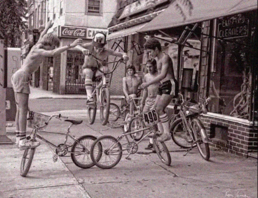 25. In 1980, Bronx Teens Turn the Streets Into a Stage With BMX Tricks 1. Waiting In Line to See Star Wars, 1977, 2. January 19th 1977, The One and Only Day it Snowed in Miami, 3. Disco Sally, a 78-Year-Old Studio 54 Regular, Becomes a Symbol of the Era in 1978, 4. A Businessman Lights a Cigarette Inside a New York City Phone Booth in 1980, 5. Two Women Sit Casually on a Fire Escape in Harlem, NYC, in 1978, 6. Harrison Ford Appears as Colonel G. Lucas in Apocalypse Now, 1979, 7. In 1978, a Toddler Poses Next to the Family's New Color TV Like It's a Family Member, 8. Salesmen Sit on the Hoods of New Cars Waiting for Buyers at a California Dealership in 1979, 9. Kids Jump From a Fire Escape Onto Mattresses in NYC's Lower East Side, 1979, 10. Comic-Con San Diego in 1980 Captures the Wild Beginnings of Pop Culture Fandom, 11. The World's Largest Disco Draws Crowds to Buffalo in 1978, 12. Young Roller Skater in Red Moves Through Midtown Manhattan, 1979, 13. In 1978, Disco Dancing Lessons Spread to Suburbs Like Beaverton, Oregon, 14. An Apple II Computer and a Young Steve Jobs Revolutionize Tech in 1977, 15. A Woman Leans in to Kiss a Windsor Guard in a Whimsical Moment, 1980, 16. Two Guys Play Atari in Their Living Room in 1978, Defining Home Entertainment, 17. National Space Invaders Championship in 1980 Showcases a New Era of Gamers, 18. A Local News Crew in Texas Interviews Parents After Taking Kids to See Alien, 1979, 19. Young Woman in a "Consenting Adult" Shirt Enjoys the Rolling Stones in 1978, 20. In 1979, Reflections on the Dance Floor Captured the Disco Craze From Above, 21. A Canadian Gas Station Refuses to Fuel Soviet Ladas to Protest the Invasion of Afghanistan, 1980, 22. Subway Riders Carry Lawn Chairs for a Beach Day in NYC, Summer 1978, 23. High School Seniors Pose Before Heading on a Ski Trip in 1980, 24. Young Girl Embraces Teddy Boy Fashion and Rock 'n' Roll Dancing, 1979, 25. In 1980, Bronx Teens Turn the Streets Into a Stage With BMX Tricks, 26. Olivia Newton-John and John Travolta Redefine Teen Style on the Set of Grease, 1978, 27. KISS Fans in Buffalo, NY, Fully Embrace Glam Rock Culture, 1978, 28. New UK Prime Minister Margaret Thatcher Celebrates Her Election Victory, 1979, 29. The Sony Walkman Hits the Market With a Bold Ad Declaring "There's a Revolution in the Streets", 1980, 30. A Young Man Spins the Top Hits of 1978 on AM Radio Studio, 31. Four New Jersey Teens Check Under the Hood of a Car With a Backwards Design, 1979, 32. Elvis Presley's Final Performance in 1977 Leaves Fans With an Iconic Farewell, 33. Protesters Flood the Capitol in March 1980 to Oppose Military Draft Registration, 34. Staten Island Families Resort to Kerosene Lamps During the 1977 Blackout