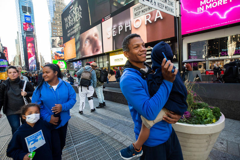 Zohran Mamdani, New York family walking in Times Square, Congresswoman Nicole Malliotakis at press conference, Rep. Mike Lawler votes with family on election day, Supporters hold large flag for Trump in NYC, Rep. Elise Stefanik questions governors during hearing, Zohran Mamdani at Tesla protest in New York City
