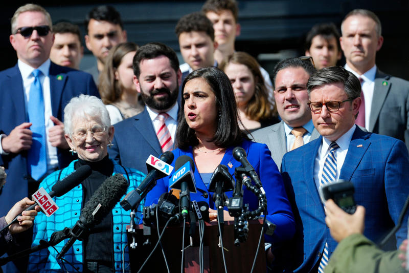 Zohran Mamdani, New York family walking in Times Square, Congresswoman Nicole Malliotakis at press conference, Rep. Mike Lawler votes with family on election day, Supporters hold large flag for Trump in NYC, Rep. Elise Stefanik questions governors during hearing, Zohran Mamdani at Tesla protest in New York City