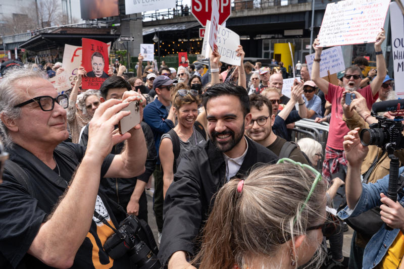 Zohran Mamdani, New York family walking in Times Square, Congresswoman Nicole Malliotakis at press conference, Rep. Mike Lawler votes with family on election day, Supporters hold large flag for Trump in NYC, Rep. Elise Stefanik questions governors during hearing, Zohran Mamdani at Tesla protest in New York City
