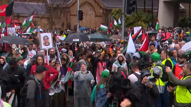 'Too many people' on bridge, organisers say, Miserable day but demonstrators march on, Protesters reach Sydney Harbour Bridge, Counter-protesters detained in Melbourne, Sydney's train stations packed with protesters, Thousands more expected to join march, Famous faces join protest, Police close Sydney Harbour Bridge, Drivers warned to avoid the city, Weather won't deter protesters in Sydney, Thousands to descend on Melbourne CBD