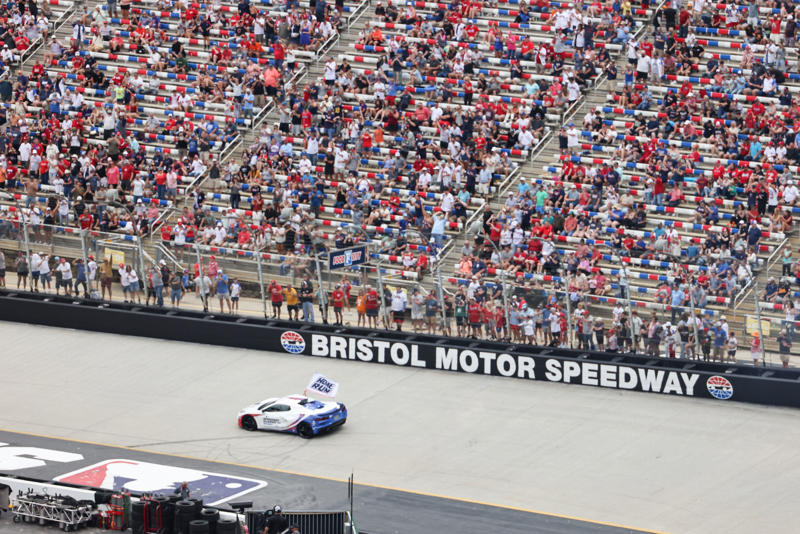 Pregame pageantry, Great spectacle, not a great view, Hall of Famers in the rain, Fewer fans returned after postponement, Bristol Motor Speedway swallows the baseball field, The Colossus looms, The Home Run Car goes racing, Checkered flag waves for Eli White