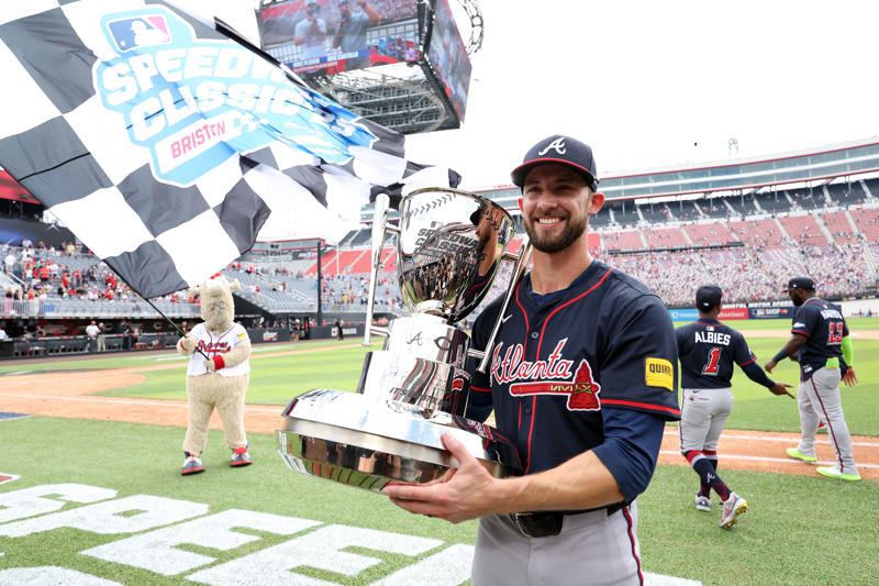 Pregame pageantry, Great spectacle, not a great view, Hall of Famers in the rain, Fewer fans returned after postponement, Bristol Motor Speedway swallows the baseball field, The Colossus looms, The Home Run Car goes racing, Checkered flag waves for Eli White