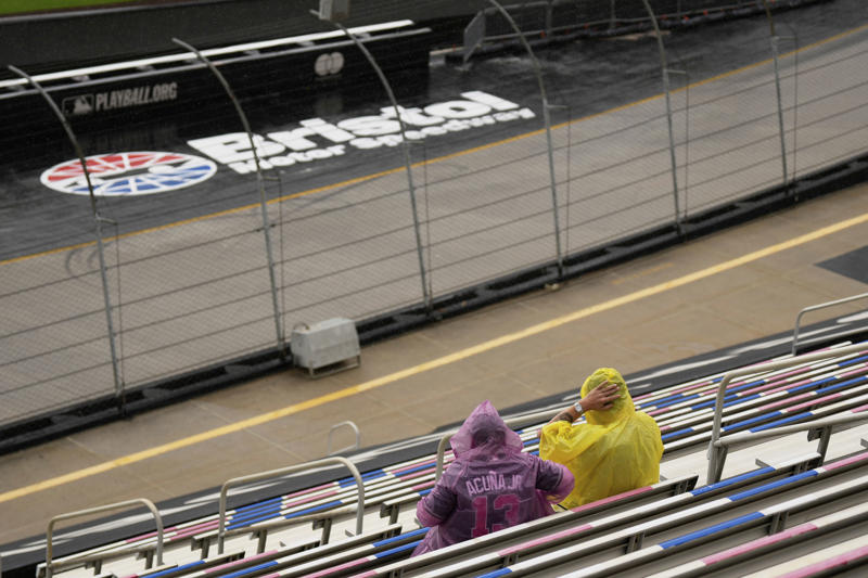Pregame pageantry, Great spectacle, not a great view, Hall of Famers in the rain, Fewer fans returned after postponement, Bristol Motor Speedway swallows the baseball field, The Colossus looms, The Home Run Car goes racing, Checkered flag waves for Eli White