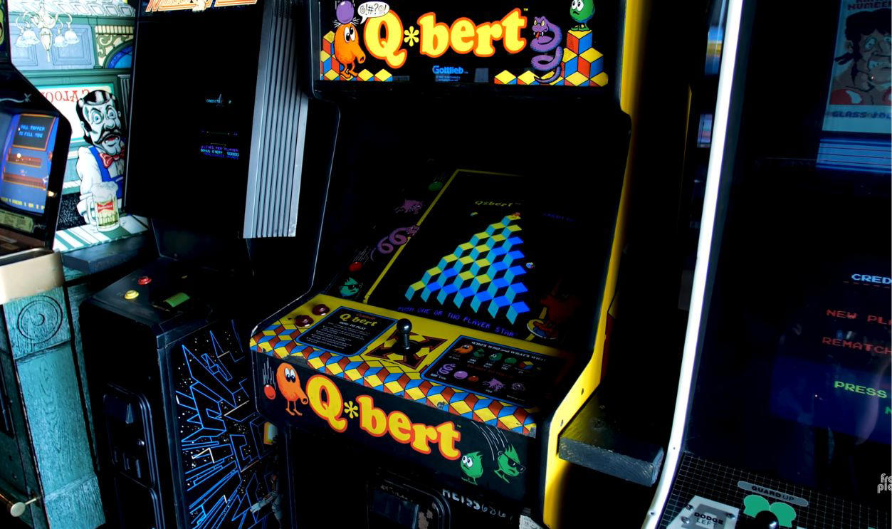 Q*bert (Gottlieb, 1982) Classic Nostalgia Worth Serious Cash, Pong (Atari, 1972), Pac-Man (Midway, 1980), Ms. Pac-Man (Midway, 1981), Galaga (Midway, 1981), Tempest (Atari, 1981), Frogger (Sega/Gremlin, 1981), Asteroids (Atari, 1979), Defender (Williams, 1981), Joust (Williams, 1982), Q*bert (Gottlieb, 1982), Tron (Bally Midway, 1982), Dragon’s Lair (Cinematronics, 1983), Punch-Out!! (Nintendo, 1984), Double Dragon (Technōs, 1987), Teenage Mutant Ninja Turtles (Konami, 1989), Street Fighter II (Capcom, 1991), Mortal Kombat (Midway, 1992), NBA Jam (Midway, 1993), The Simpsons (Konami, 1991), Rampage (Bally Midway, 1986), Gauntlet (Atari, 1985)