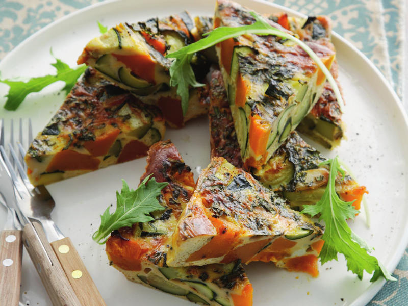 Can you reheat frittata?, Frittata recipes for breakfast, lunch and dinner, Mega vegie and haloumi frittata , Basil frittata with smoked salmon , Rainbow chard and three-cheese frittata , Roast pumpkin and zucchini frittata , Roasted pumpkin, spinach and fetta slice , Primavera frittata , Asparagus, tomato, ricotta and basil frittata , Potato, capsicum and spinach frittata , Quick three-cheese frittata , Kale and quinoa frittata , Pea and broad bean frittata , Rocket and prosciutto frittata , Ham and egg frittata , Chorizo & potato frittata , Asparagus frittata , Silverbeet frittata , Smoked trout frittata , Chilli and vegetable frittata , Broccoli and cheese frittata , Baked potato, ham and cheese frittata , Spanish frittata , Wild mushroom and green onion frittata , Potato, capsicum and olive frittata , Three-cheese pasta frittata , Zucchini and corn frittatas , Capsicum and potato frittata , Green power mini frittatas with spinach and feta , Bacon, pea and corn frittata , Asparagus & fetta frittata , Zucchini flower and tomato frittata , Tomato, feta and pancetta frittata , Why we love these frittatas, More quick & easy recipes