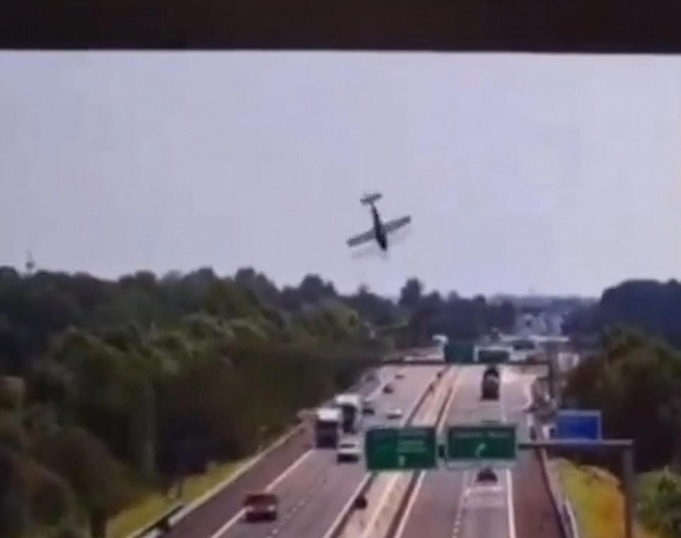 Plane crashes onto busy motorway exploding into a fireball