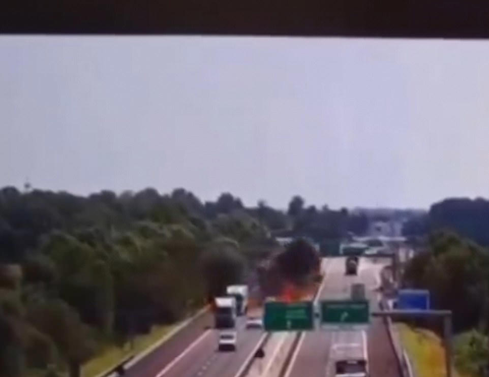 Plane crashes onto busy motorway exploding into a fireball