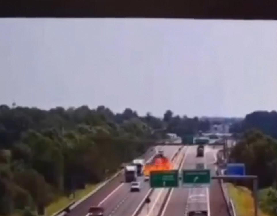 Plane crashes onto busy motorway exploding into a fireball
