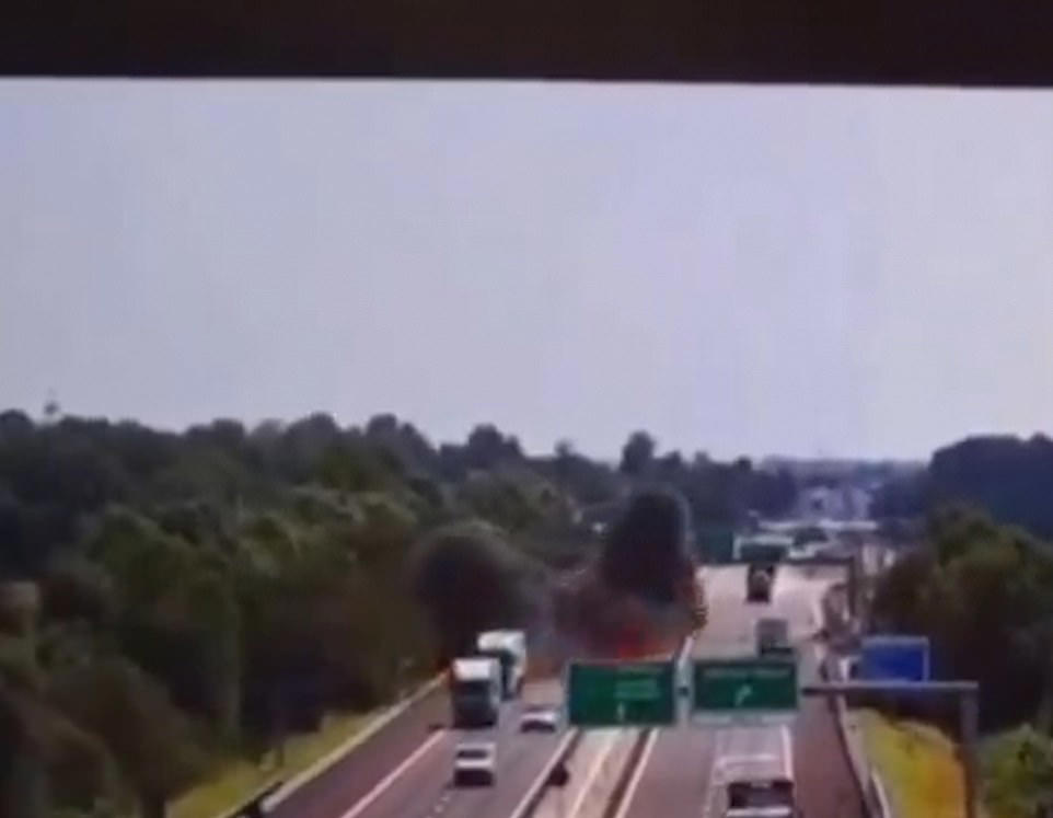 Plane crashes onto busy motorway exploding into a fireball