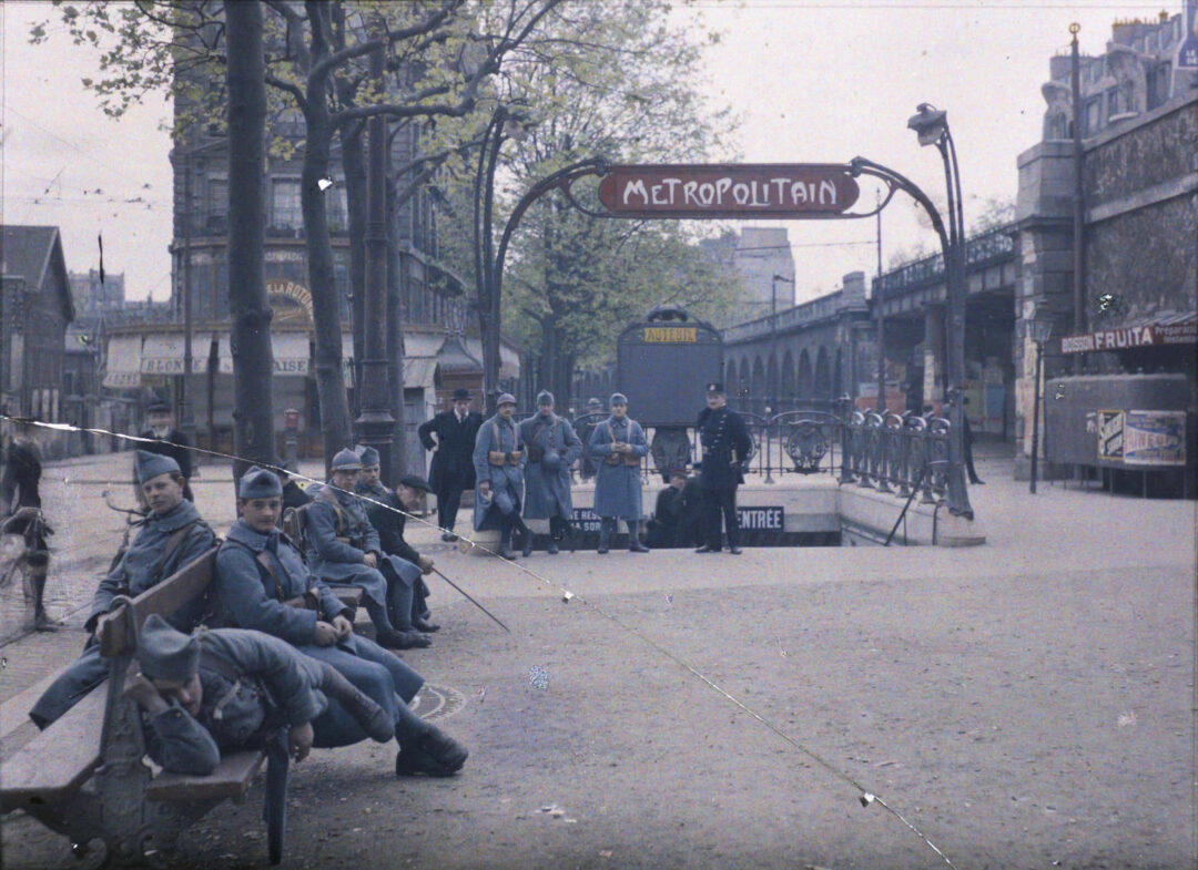 6. ‘Soldiers at the Metro Station Auteuil on the Boulevard Excelmans in Paris, France, on May 1, 1920’ 1. A Woman Strolls Through Paris While Reading the Paper, 2. Two Kids Play With a Toy Car on a Cobblestone Street With the Moulin Rouge in the Distance, 3. ‘A Pair of Lovers in Paris, France’, 4. Visitors Stroll Beneath the Eiffel Tower During the 1925 Exposition Internationale des Arts Décoratifs, 5. Colorized Image of Parisians Browsing Flowers Near the Tour de l’Horloge on the Île de la Cité, One of the City’s Oldest Clocks, 6. ‘Soldiers at the Metro Station Auteuil on the Boulevard Excelmans in Paris, France, on May 1, 1920’, 7. Colorized Image of a Hot Air Balloon Pre-Take Off, May 1923, 8. Two Women Enjoy a Coffee on a Terrace, 1925, 9. ‘A Street Scene in Paris During the 1924 Olympics’, 10. A Woman Enjoys a Meal Aboard a Zeppelin Heading to Berlin, 1928, 11. A Couple Dances Along the Seine as People Look on, 12. Singer and Dancer Josephine Baker Pictured at a Cabaret, 1927, 13. Three Children Pause for a Snack With the Sacré-Coeur in the Distance, 14. ‘Ernest Hemingway in Paris, 1920s’, 15. ‘Citroen Automobile Designed by Sonia Delaunay in Paris, 1925’, 16. A Young Gloria Vanderbilt and Her Pet Dog Playing in Front of the Eiffel Tower, 1921, 17. ‘Backstage at the Moulin Rouge, Paris, 1924’, 18. ‘Early Color Photography in Paris, France, 1920’, 19. Josephine Baker Taking Her Pet Cheetah for a Walk in Paris, 1923