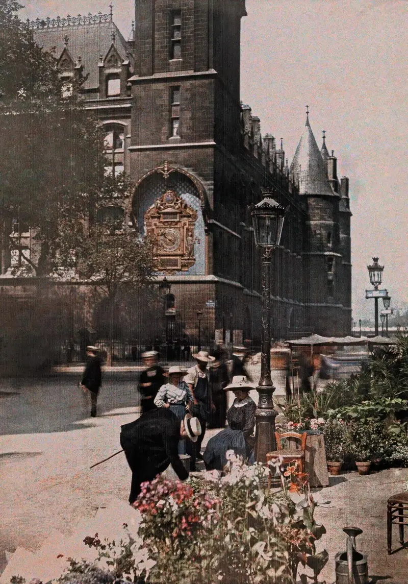 5. Colorized Image of Parisians Browsing Flowers Near the Tour de l’Horloge on the Île de la Cité, One of the City’s Oldest Clocks 1. A Woman Strolls Through Paris While Reading the Paper, 2. Two Kids Play With a Toy Car on a Cobblestone Street With the Moulin Rouge in the Distance, 3. ‘A Pair of Lovers in Paris, France’, 4. Visitors Stroll Beneath the Eiffel Tower During the 1925 Exposition Internationale des Arts Décoratifs, 5. Colorized Image of Parisians Browsing Flowers Near the Tour de l’Horloge on the Île de la Cité, One of the City’s Oldest Clocks, 6. ‘Soldiers at the Metro Station Auteuil on the Boulevard Excelmans in Paris, France, on May 1, 1920’, 7. Colorized Image of a Hot Air Balloon Pre-Take Off, May 1923, 8. Two Women Enjoy a Coffee on a Terrace, 1925, 9. ‘A Street Scene in Paris During the 1924 Olympics’, 10. A Woman Enjoys a Meal Aboard a Zeppelin Heading to Berlin, 1928, 11. A Couple Dances Along the Seine as People Look on, 12. Singer and Dancer Josephine Baker Pictured at a Cabaret, 1927, 13. Three Children Pause for a Snack With the Sacré-Coeur in the Distance, 14. ‘Ernest Hemingway in Paris, 1920s’, 15. ‘Citroen Automobile Designed by Sonia Delaunay in Paris, 1925’, 16. A Young Gloria Vanderbilt and Her Pet Dog Playing in Front of the Eiffel Tower, 1921, 17. ‘Backstage at the Moulin Rouge, Paris, 1924’, 18. ‘Early Color Photography in Paris, France, 1920’, 19. Josephine Baker Taking Her Pet Cheetah for a Walk in Paris, 1923