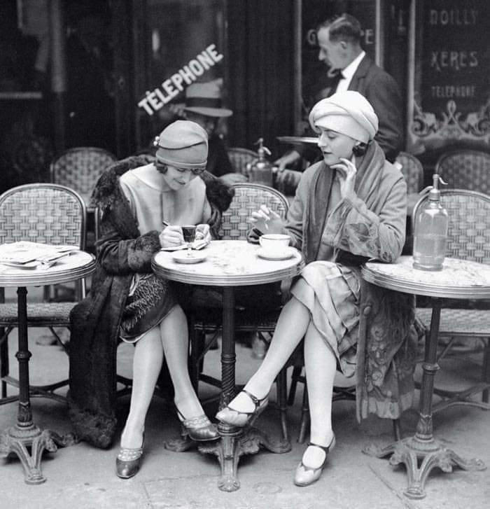 8. Two Women Enjoy a Coffee on a Terrace, 1925 1. A Woman Strolls Through Paris While Reading the Paper, 2. Two Kids Play With a Toy Car on a Cobblestone Street With the Moulin Rouge in the Distance, 3. ‘A Pair of Lovers in Paris, France’, 4. Visitors Stroll Beneath the Eiffel Tower During the 1925 Exposition Internationale des Arts Décoratifs, 5. Colorized Image of Parisians Browsing Flowers Near the Tour de l’Horloge on the Île de la Cité, One of the City’s Oldest Clocks, 6. ‘Soldiers at the Metro Station Auteuil on the Boulevard Excelmans in Paris, France, on May 1, 1920’, 7. Colorized Image of a Hot Air Balloon Pre-Take Off, May 1923, 8. Two Women Enjoy a Coffee on a Terrace, 1925, 9. ‘A Street Scene in Paris During the 1924 Olympics’, 10. A Woman Enjoys a Meal Aboard a Zeppelin Heading to Berlin, 1928, 11. A Couple Dances Along the Seine as People Look on, 12. Singer and Dancer Josephine Baker Pictured at a Cabaret, 1927, 13. Three Children Pause for a Snack With the Sacré-Coeur in the Distance, 14. ‘Ernest Hemingway in Paris, 1920s’, 15. ‘Citroen Automobile Designed by Sonia Delaunay in Paris, 1925’, 16. A Young Gloria Vanderbilt and Her Pet Dog Playing in Front of the Eiffel Tower, 1921, 17. ‘Backstage at the Moulin Rouge, Paris, 1924’, 18. ‘Early Color Photography in Paris, France, 1920’, 19. Josephine Baker Taking Her Pet Cheetah for a Walk in Paris, 1923