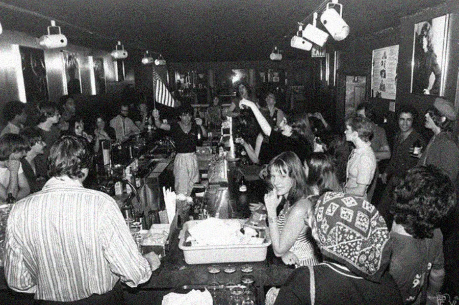 13. Packed Nights and Rock 'n' Roll Vibes Inside Max's Kansas City, NYC, 1976 1. Queen Was on Fire in 1976, Even if the Hairstyles Were Questionable, 2. The Hudson River Lit Up with Boats and Patriotism on the 4th of July, 1976, 3. Barefoot and Beaming, Locals Paraded with Pride Through Pickering Beach in 1976, 4. A Helpful Hand at Kmart's Camera Counter as Film Photography Ruled 1976, 5. A Snapshot of LA Youth in the Summer of '76, 6. Festive Fries and Holiday Cheer at McDonald's in the Heart of the Seventies, 7. Marching to the Beat of Freedom During the 1976 Bicentennial Celebration, 8. A Fall Night on Broadway and 44th in 1976 Manhattan, 9. Candlelit Conversations and Cozy Vibes at a 1976 House Party, 10. This Toddler Had Style to Spare in 1976, 11. Lazy Beach Days and Summer Love in South Shields, 1976, 12. Packed Nights and Rock 'n' Roll Vibes Inside Max's Kansas City, NYC, 1976, 13. Americans Gather Around the Bicentennial "Freedom Train" Carrying Priceless Pieces of History, 14. Teenage Love Caught on Camera in a Quiet New York Room, 1976, 15. Chaos and Cheers at the Battle Royal in L.A.'s Olympic Auditorium, 16. Jodie Foster Stuns at Just 14 in the Gritty Classic Taxi Driver, 1976, 17. The Power of Christ Compels You at Detroit’s Infamous Exorcist Lounge, 1976, 18. Arcade Dreams and Mall Magic Collide at Old Chicago in 1976, 19. School Vaccinations in 1976 Highland Park, 20. Dancing in the Streets of Brooklyn During A Joyful Block Party Moment in 1976, 21. Serving Up Street Flavor Outside the Met on a Summer Day in 1976, 22. A Group of Kids Waits Patiently for the Subway in a Gritty 1976 New York City, 23. Neighborhood Kids Gear Up for Halloween With Their Spookiest Masks in 1976, 24. President Jimmy Carter Casually Hops a Fence at LaGuardia Airport With an Aide, 1976, 25. Dining Above the Clouds at Windows on the World, 1976, 26. David Bowie in 1976, Redefining Cool with Every Glance, 27. AC/DC Rocking Their Way to Global Fame in 1976, 28. A Young Woman Hitchhiking Through Florida's Sun-Soaked Highways in 1976, 29. A Group of Young Concertgoers Soaking Up the Vibes in Ohio, 30. A Surprising Snapshot of Hollywood Charm, 31. When Superheroes Took the Plunge at SeaWorld's Wild 1976 Show, 32. Charlie's Angels Redefined Cool and Confidence in 1976, 33. Kiss Turns Heads While Strutting Through NYC in Full Costume, 1976