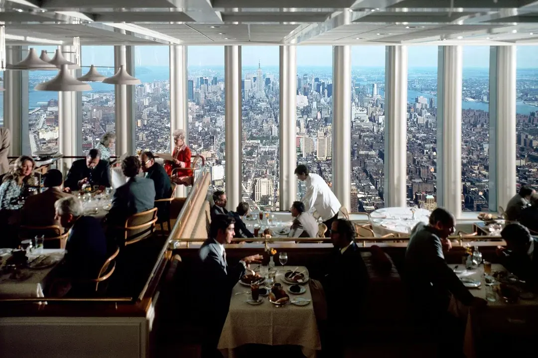 26. Dining Above the Clouds at Windows on the World, 1976 1. Queen Was on Fire in 1976, Even if the Hairstyles Were Questionable, 2. The Hudson River Lit Up with Boats and Patriotism on the 4th of July, 1976, 3. Barefoot and Beaming, Locals Paraded with Pride Through Pickering Beach in 1976, 4. A Helpful Hand at Kmart's Camera Counter as Film Photography Ruled 1976, 5. A Snapshot of LA Youth in the Summer of '76, 6. Festive Fries and Holiday Cheer at McDonald's in the Heart of the Seventies, 7. Marching to the Beat of Freedom During the 1976 Bicentennial Celebration, 8. A Fall Night on Broadway and 44th in 1976 Manhattan, 9. Candlelit Conversations and Cozy Vibes at a 1976 House Party, 10. This Toddler Had Style to Spare in 1976, 11. Lazy Beach Days and Summer Love in South Shields, 1976, 12. Packed Nights and Rock 'n' Roll Vibes Inside Max's Kansas City, NYC, 1976, 13. Americans Gather Around the Bicentennial "Freedom Train" Carrying Priceless Pieces of History, 14. Teenage Love Caught on Camera in a Quiet New York Room, 1976, 15. Chaos and Cheers at the Battle Royal in L.A.'s Olympic Auditorium, 16. Jodie Foster Stuns at Just 14 in the Gritty Classic Taxi Driver, 1976, 17. The Power of Christ Compels You at Detroit’s Infamous Exorcist Lounge, 1976, 18. Arcade Dreams and Mall Magic Collide at Old Chicago in 1976, 19. School Vaccinations in 1976 Highland Park, 20. Dancing in the Streets of Brooklyn During A Joyful Block Party Moment in 1976, 21. Serving Up Street Flavor Outside the Met on a Summer Day in 1976, 22. A Group of Kids Waits Patiently for the Subway in a Gritty 1976 New York City, 23. Neighborhood Kids Gear Up for Halloween With Their Spookiest Masks in 1976, 24. President Jimmy Carter Casually Hops a Fence at LaGuardia Airport With an Aide, 1976, 25. Dining Above the Clouds at Windows on the World, 1976, 26. David Bowie in 1976, Redefining Cool with Every Glance, 27. AC/DC Rocking Their Way to Global Fame in 1976, 28. A Young Woman Hitchhiking Through Florida's Sun-Soaked Highways in 1976, 29. A Group of Young Concertgoers Soaking Up the Vibes in Ohio, 30. A Surprising Snapshot of Hollywood Charm, 31. When Superheroes Took the Plunge at SeaWorld's Wild 1976 Show, 32. Charlie's Angels Redefined Cool and Confidence in 1976, 33. Kiss Turns Heads While Strutting Through NYC in Full Costume, 1976