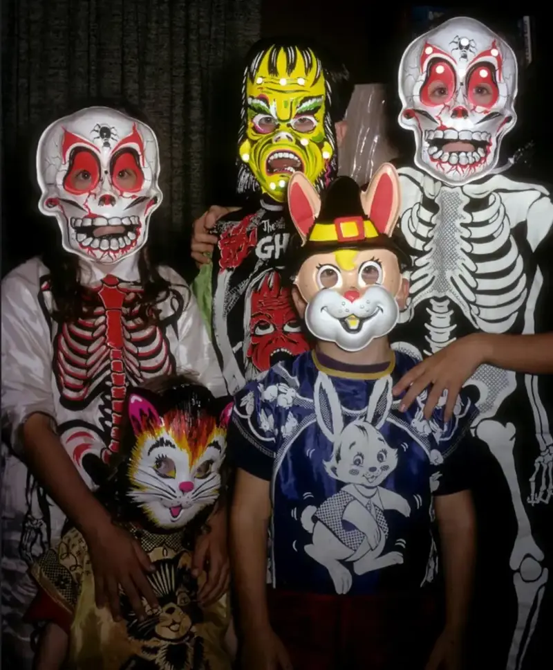 24. Neighborhood Kids Gear Up for Halloween With Their Spookiest Masks in 1976 1. Queen Was on Fire in 1976, Even if the Hairstyles Were Questionable, 2. The Hudson River Lit Up with Boats and Patriotism on the 4th of July, 1976, 3. Barefoot and Beaming, Locals Paraded with Pride Through Pickering Beach in 1976, 4. A Helpful Hand at Kmart's Camera Counter as Film Photography Ruled 1976, 5. A Snapshot of LA Youth in the Summer of '76, 6. Festive Fries and Holiday Cheer at McDonald's in the Heart of the Seventies, 7. Marching to the Beat of Freedom During the 1976 Bicentennial Celebration, 8. A Fall Night on Broadway and 44th in 1976 Manhattan, 9. Candlelit Conversations and Cozy Vibes at a 1976 House Party, 10. This Toddler Had Style to Spare in 1976, 11. Lazy Beach Days and Summer Love in South Shields, 1976, 12. Packed Nights and Rock 'n' Roll Vibes Inside Max's Kansas City, NYC, 1976, 13. Americans Gather Around the Bicentennial "Freedom Train" Carrying Priceless Pieces of History, 14. Teenage Love Caught on Camera in a Quiet New York Room, 1976, 15. Chaos and Cheers at the Battle Royal in L.A.'s Olympic Auditorium, 16. Jodie Foster Stuns at Just 14 in the Gritty Classic Taxi Driver, 1976, 17. The Power of Christ Compels You at Detroit’s Infamous Exorcist Lounge, 1976, 18. Arcade Dreams and Mall Magic Collide at Old Chicago in 1976, 19. School Vaccinations in 1976 Highland Park, 20. Dancing in the Streets of Brooklyn During A Joyful Block Party Moment in 1976, 21. Serving Up Street Flavor Outside the Met on a Summer Day in 1976, 22. A Group of Kids Waits Patiently for the Subway in a Gritty 1976 New York City, 23. Neighborhood Kids Gear Up for Halloween With Their Spookiest Masks in 1976, 24. President Jimmy Carter Casually Hops a Fence at LaGuardia Airport With an Aide, 1976, 25. Dining Above the Clouds at Windows on the World, 1976, 26. David Bowie in 1976, Redefining Cool with Every Glance, 27. AC/DC Rocking Their Way to Global Fame in 1976, 28. A Young Woman Hitchhiking Through Florida's Sun-Soaked Highways in 1976, 29. A Group of Young Concertgoers Soaking Up the Vibes in Ohio, 30. A Surprising Snapshot of Hollywood Charm, 31. When Superheroes Took the Plunge at SeaWorld's Wild 1976 Show, 32. Charlie's Angels Redefined Cool and Confidence in 1976, 33. Kiss Turns Heads While Strutting Through NYC in Full Costume, 1976