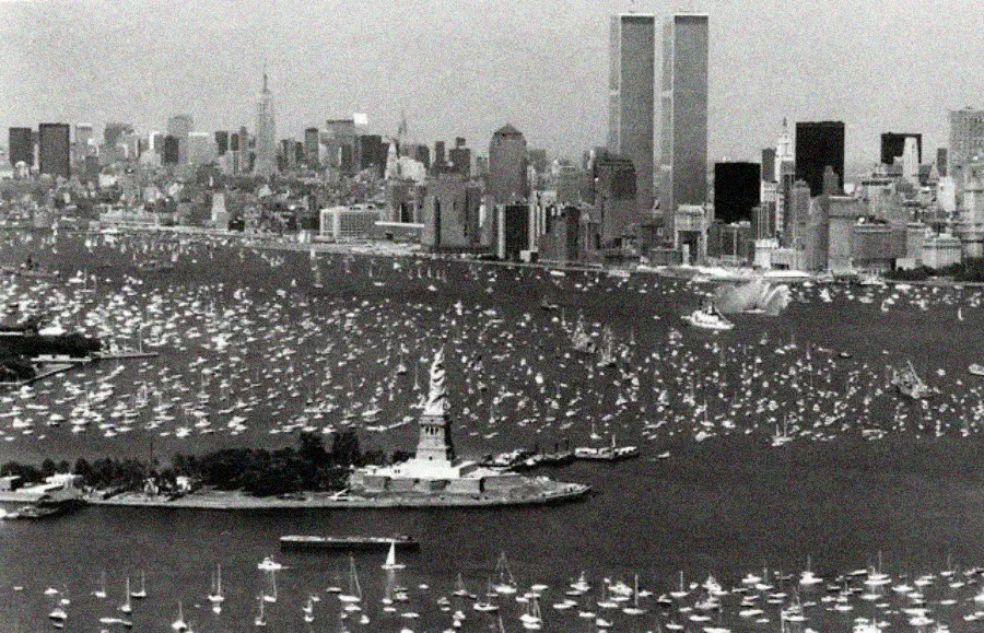 2. The Hudson River Lit Up with Boats and Patriotism on the 4th of July, 1976 1. Queen Was on Fire in 1976, Even if the Hairstyles Were Questionable, 2. The Hudson River Lit Up with Boats and Patriotism on the 4th of July, 1976, 3. Barefoot and Beaming, Locals Paraded with Pride Through Pickering Beach in 1976, 4. A Helpful Hand at Kmart's Camera Counter as Film Photography Ruled 1976, 5. A Snapshot of LA Youth in the Summer of '76, 6. Festive Fries and Holiday Cheer at McDonald's in the Heart of the Seventies, 7. Marching to the Beat of Freedom During the 1976 Bicentennial Celebration, 8. A Fall Night on Broadway and 44th in 1976 Manhattan, 9. Candlelit Conversations and Cozy Vibes at a 1976 House Party, 10. This Toddler Had Style to Spare in 1976, 11. Lazy Beach Days and Summer Love in South Shields, 1976, 12. Packed Nights and Rock 'n' Roll Vibes Inside Max's Kansas City, NYC, 1976, 13. Americans Gather Around the Bicentennial "Freedom Train" Carrying Priceless Pieces of History, 14. Teenage Love Caught on Camera in a Quiet New York Room, 1976, 15. Chaos and Cheers at the Battle Royal in L.A.'s Olympic Auditorium, 16. Jodie Foster Stuns at Just 14 in the Gritty Classic Taxi Driver, 1976, 17. The Power of Christ Compels You at Detroit’s Infamous Exorcist Lounge, 1976, 18. Arcade Dreams and Mall Magic Collide at Old Chicago in 1976, 19. School Vaccinations in 1976 Highland Park, 20. Dancing in the Streets of Brooklyn During A Joyful Block Party Moment in 1976, 21. Serving Up Street Flavor Outside the Met on a Summer Day in 1976, 22. A Group of Kids Waits Patiently for the Subway in a Gritty 1976 New York City, 23. Neighborhood Kids Gear Up for Halloween With Their Spookiest Masks in 1976, 24. President Jimmy Carter Casually Hops a Fence at LaGuardia Airport With an Aide, 1976, 25. Dining Above the Clouds at Windows on the World, 1976, 26. David Bowie in 1976, Redefining Cool with Every Glance, 27. AC/DC Rocking Their Way to Global Fame in 1976, 28. A Young Woman Hitchhiking Through Florida's Sun-Soaked Highways in 1976, 29. A Group of Young Concertgoers Soaking Up the Vibes in Ohio, 30. A Surprising Snapshot of Hollywood Charm, 31. When Superheroes Took the Plunge at SeaWorld's Wild 1976 Show, 32. Charlie's Angels Redefined Cool and Confidence in 1976, 33. Kiss Turns Heads While Strutting Through NYC in Full Costume, 1976