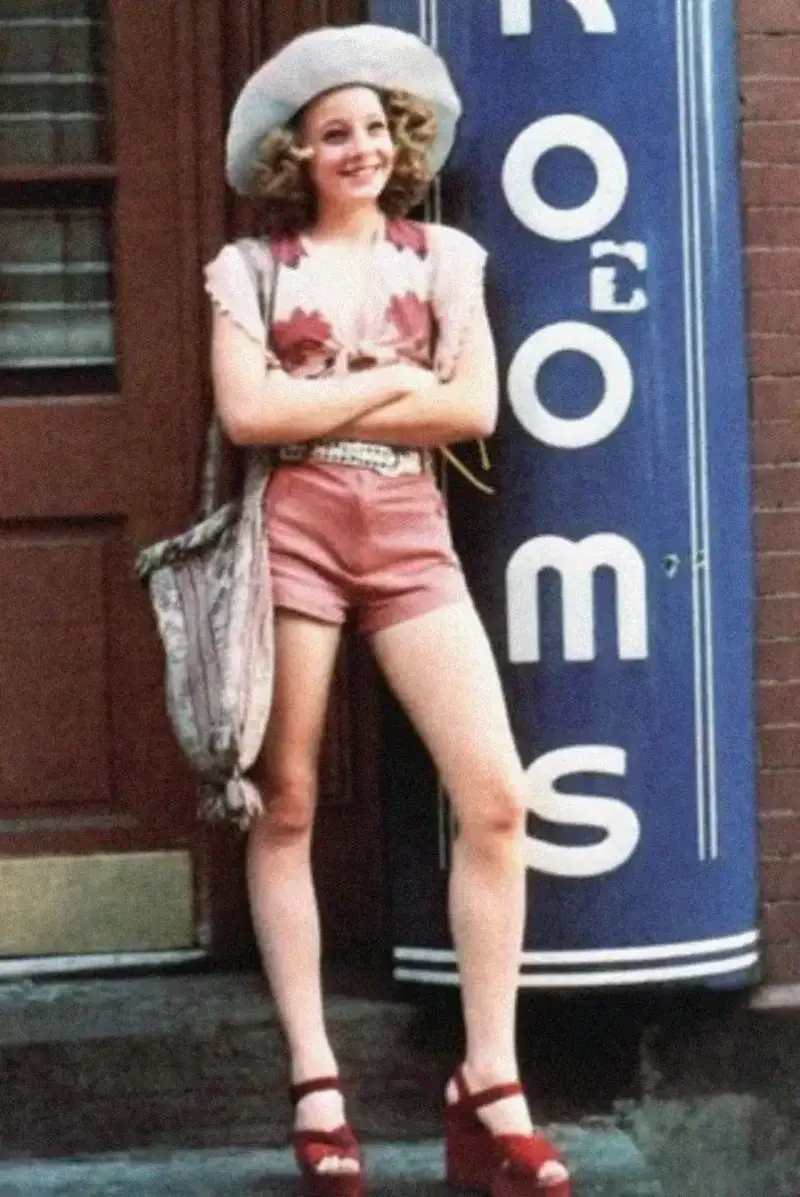 17. Jodie Foster Stuns at Just 14 in the Gritty Classic Taxi Driver, 1976 1. Queen Was on Fire in 1976, Even if the Hairstyles Were Questionable, 2. The Hudson River Lit Up with Boats and Patriotism on the 4th of July, 1976, 3. Barefoot and Beaming, Locals Paraded with Pride Through Pickering Beach in 1976, 4. A Helpful Hand at Kmart's Camera Counter as Film Photography Ruled 1976, 5. A Snapshot of LA Youth in the Summer of '76, 6. Festive Fries and Holiday Cheer at McDonald's in the Heart of the Seventies, 7. Marching to the Beat of Freedom During the 1976 Bicentennial Celebration, 8. A Fall Night on Broadway and 44th in 1976 Manhattan, 9. Candlelit Conversations and Cozy Vibes at a 1976 House Party, 10. This Toddler Had Style to Spare in 1976, 11. Lazy Beach Days and Summer Love in South Shields, 1976, 12. Packed Nights and Rock 'n' Roll Vibes Inside Max's Kansas City, NYC, 1976, 13. Americans Gather Around the Bicentennial "Freedom Train" Carrying Priceless Pieces of History, 14. Teenage Love Caught on Camera in a Quiet New York Room, 1976, 15. Chaos and Cheers at the Battle Royal in L.A.'s Olympic Auditorium, 16. Jodie Foster Stuns at Just 14 in the Gritty Classic Taxi Driver, 1976, 17. The Power of Christ Compels You at Detroit’s Infamous Exorcist Lounge, 1976, 18. Arcade Dreams and Mall Magic Collide at Old Chicago in 1976, 19. School Vaccinations in 1976 Highland Park, 20. Dancing in the Streets of Brooklyn During A Joyful Block Party Moment in 1976, 21. Serving Up Street Flavor Outside the Met on a Summer Day in 1976, 22. A Group of Kids Waits Patiently for the Subway in a Gritty 1976 New York City, 23. Neighborhood Kids Gear Up for Halloween With Their Spookiest Masks in 1976, 24. President Jimmy Carter Casually Hops a Fence at LaGuardia Airport With an Aide, 1976, 25. Dining Above the Clouds at Windows on the World, 1976, 26. David Bowie in 1976, Redefining Cool with Every Glance, 27. AC/DC Rocking Their Way to Global Fame in 1976, 28. A Young Woman Hitchhiking Through Florida's Sun-Soaked Highways in 1976, 29. A Group of Young Concertgoers Soaking Up the Vibes in Ohio, 30. A Surprising Snapshot of Hollywood Charm, 31. When Superheroes Took the Plunge at SeaWorld's Wild 1976 Show, 32. Charlie's Angels Redefined Cool and Confidence in 1976, 33. Kiss Turns Heads While Strutting Through NYC in Full Costume, 1976