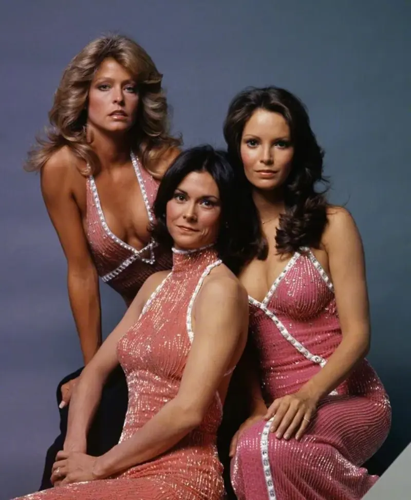 33. Charlie's Angels Redefined Cool and Confidence in 1976 1. Queen Was on Fire in 1976, Even if the Hairstyles Were Questionable, 2. The Hudson River Lit Up with Boats and Patriotism on the 4th of July, 1976, 3. Barefoot and Beaming, Locals Paraded with Pride Through Pickering Beach in 1976, 4. A Helpful Hand at Kmart's Camera Counter as Film Photography Ruled 1976, 5. A Snapshot of LA Youth in the Summer of '76, 6. Festive Fries and Holiday Cheer at McDonald's in the Heart of the Seventies, 7. Marching to the Beat of Freedom During the 1976 Bicentennial Celebration, 8. A Fall Night on Broadway and 44th in 1976 Manhattan, 9. Candlelit Conversations and Cozy Vibes at a 1976 House Party, 10. This Toddler Had Style to Spare in 1976, 11. Lazy Beach Days and Summer Love in South Shields, 1976, 12. Packed Nights and Rock 'n' Roll Vibes Inside Max's Kansas City, NYC, 1976, 13. Americans Gather Around the Bicentennial "Freedom Train" Carrying Priceless Pieces of History, 14. Teenage Love Caught on Camera in a Quiet New York Room, 1976, 15. Chaos and Cheers at the Battle Royal in L.A.'s Olympic Auditorium, 16. Jodie Foster Stuns at Just 14 in the Gritty Classic Taxi Driver, 1976, 17. The Power of Christ Compels You at Detroit’s Infamous Exorcist Lounge, 1976, 18. Arcade Dreams and Mall Magic Collide at Old Chicago in 1976, 19. School Vaccinations in 1976 Highland Park, 20. Dancing in the Streets of Brooklyn During A Joyful Block Party Moment in 1976, 21. Serving Up Street Flavor Outside the Met on a Summer Day in 1976, 22. A Group of Kids Waits Patiently for the Subway in a Gritty 1976 New York City, 23. Neighborhood Kids Gear Up for Halloween With Their Spookiest Masks in 1976, 24. President Jimmy Carter Casually Hops a Fence at LaGuardia Airport With an Aide, 1976, 25. Dining Above the Clouds at Windows on the World, 1976, 26. David Bowie in 1976, Redefining Cool with Every Glance, 27. AC/DC Rocking Their Way to Global Fame in 1976, 28. A Young Woman Hitchhiking Through Florida's Sun-Soaked Highways in 1976, 29. A Group of Young Concertgoers Soaking Up the Vibes in Ohio, 30. A Surprising Snapshot of Hollywood Charm, 31. When Superheroes Took the Plunge at SeaWorld's Wild 1976 Show, 32. Charlie's Angels Redefined Cool and Confidence in 1976, 33. Kiss Turns Heads While Strutting Through NYC in Full Costume, 1976