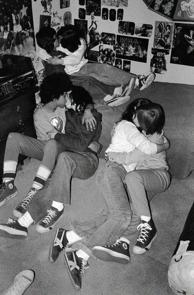 15. Teenage Love Caught on Camera in a Quiet New York Room, 1976 1. Queen Was on Fire in 1976, Even if the Hairstyles Were Questionable, 2. The Hudson River Lit Up with Boats and Patriotism on the 4th of July, 1976, 3. Barefoot and Beaming, Locals Paraded with Pride Through Pickering Beach in 1976, 4. A Helpful Hand at Kmart's Camera Counter as Film Photography Ruled 1976, 5. A Snapshot of LA Youth in the Summer of '76, 6. Festive Fries and Holiday Cheer at McDonald's in the Heart of the Seventies, 7. Marching to the Beat of Freedom During the 1976 Bicentennial Celebration, 8. A Fall Night on Broadway and 44th in 1976 Manhattan, 9. Candlelit Conversations and Cozy Vibes at a 1976 House Party, 10. This Toddler Had Style to Spare in 1976, 11. Lazy Beach Days and Summer Love in South Shields, 1976, 12. Packed Nights and Rock 'n' Roll Vibes Inside Max's Kansas City, NYC, 1976, 13. Americans Gather Around the Bicentennial "Freedom Train" Carrying Priceless Pieces of History, 14. Teenage Love Caught on Camera in a Quiet New York Room, 1976, 15. Chaos and Cheers at the Battle Royal in L.A.'s Olympic Auditorium, 16. Jodie Foster Stuns at Just 14 in the Gritty Classic Taxi Driver, 1976, 17. The Power of Christ Compels You at Detroit’s Infamous Exorcist Lounge, 1976, 18. Arcade Dreams and Mall Magic Collide at Old Chicago in 1976, 19. School Vaccinations in 1976 Highland Park, 20. Dancing in the Streets of Brooklyn During A Joyful Block Party Moment in 1976, 21. Serving Up Street Flavor Outside the Met on a Summer Day in 1976, 22. A Group of Kids Waits Patiently for the Subway in a Gritty 1976 New York City, 23. Neighborhood Kids Gear Up for Halloween With Their Spookiest Masks in 1976, 24. President Jimmy Carter Casually Hops a Fence at LaGuardia Airport With an Aide, 1976, 25. Dining Above the Clouds at Windows on the World, 1976, 26. David Bowie in 1976, Redefining Cool with Every Glance, 27. AC/DC Rocking Their Way to Global Fame in 1976, 28. A Young Woman Hitchhiking Through Florida's Sun-Soaked Highways in 1976, 29. A Group of Young Concertgoers Soaking Up the Vibes in Ohio, 30. A Surprising Snapshot of Hollywood Charm, 31. When Superheroes Took the Plunge at SeaWorld's Wild 1976 Show, 32. Charlie's Angels Redefined Cool and Confidence in 1976, 33. Kiss Turns Heads While Strutting Through NYC in Full Costume, 1976