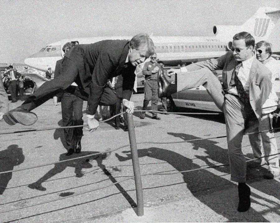 25. President Jimmy Carter Casually Hops a Fence at LaGuardia Airport With an Aide, 1976 1. Queen Was on Fire in 1976, Even if the Hairstyles Were Questionable, 2. The Hudson River Lit Up with Boats and Patriotism on the 4th of July, 1976, 3. Barefoot and Beaming, Locals Paraded with Pride Through Pickering Beach in 1976, 4. A Helpful Hand at Kmart's Camera Counter as Film Photography Ruled 1976, 5. A Snapshot of LA Youth in the Summer of '76, 6. Festive Fries and Holiday Cheer at McDonald's in the Heart of the Seventies, 7. Marching to the Beat of Freedom During the 1976 Bicentennial Celebration, 8. A Fall Night on Broadway and 44th in 1976 Manhattan, 9. Candlelit Conversations and Cozy Vibes at a 1976 House Party, 10. This Toddler Had Style to Spare in 1976, 11. Lazy Beach Days and Summer Love in South Shields, 1976, 12. Packed Nights and Rock 'n' Roll Vibes Inside Max's Kansas City, NYC, 1976, 13. Americans Gather Around the Bicentennial "Freedom Train" Carrying Priceless Pieces of History, 14. Teenage Love Caught on Camera in a Quiet New York Room, 1976, 15. Chaos and Cheers at the Battle Royal in L.A.'s Olympic Auditorium, 16. Jodie Foster Stuns at Just 14 in the Gritty Classic Taxi Driver, 1976, 17. The Power of Christ Compels You at Detroit’s Infamous Exorcist Lounge, 1976, 18. Arcade Dreams and Mall Magic Collide at Old Chicago in 1976, 19. School Vaccinations in 1976 Highland Park, 20. Dancing in the Streets of Brooklyn During A Joyful Block Party Moment in 1976, 21. Serving Up Street Flavor Outside the Met on a Summer Day in 1976, 22. A Group of Kids Waits Patiently for the Subway in a Gritty 1976 New York City, 23. Neighborhood Kids Gear Up for Halloween With Their Spookiest Masks in 1976, 24. President Jimmy Carter Casually Hops a Fence at LaGuardia Airport With an Aide, 1976, 25. Dining Above the Clouds at Windows on the World, 1976, 26. David Bowie in 1976, Redefining Cool with Every Glance, 27. AC/DC Rocking Their Way to Global Fame in 1976, 28. A Young Woman Hitchhiking Through Florida's Sun-Soaked Highways in 1976, 29. A Group of Young Concertgoers Soaking Up the Vibes in Ohio, 30. A Surprising Snapshot of Hollywood Charm, 31. When Superheroes Took the Plunge at SeaWorld's Wild 1976 Show, 32. Charlie's Angels Redefined Cool and Confidence in 1976, 33. Kiss Turns Heads While Strutting Through NYC in Full Costume, 1976