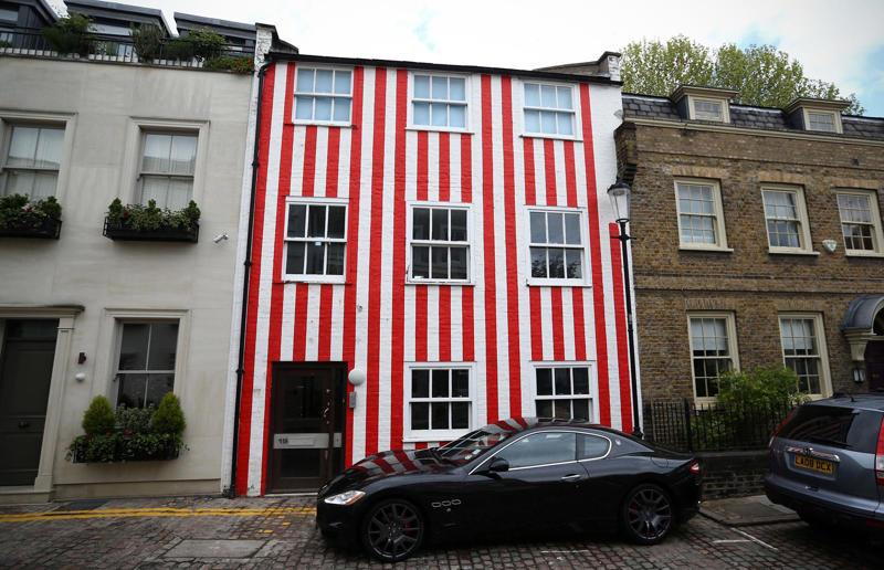Surprising real estate spats from around the globe Surprising real estate spats from around the globe, Homeowner built fence through neighbour's swimming pool, Woman gave house 'circus' makeover after planning complaints, Ruffled residents take action against rowdy roosters, Man builds three-foot-wide house to block neighbour’s outlook, Goalkeeper took chainsaw to neighbour’s garage over obstructed view, Neighbours' tree cut in half over bird mess, Neighbours' tree cut in half over bird poo squabble, Millionaire couple sued by neighbours over supercar headache, Airbnb host riled neighbours with pink emoji paint job, Civil War veteran built skinny house to spite his brother, Vegan sued neighbours over barbecue smells, Neighbour filed noise complaint over rowdy sea lions, Disgruntled man listed part of homeowner's wall for £37k