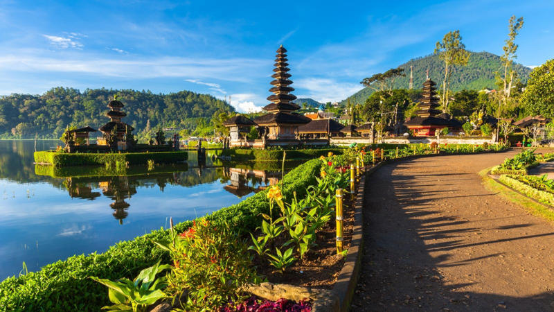 Bali, Indonesia: Bali has become a byword for laid-back luxury, making it an ideal destination for couples, honeymooners, and anyone seeking a tranquil getaway. The island’s energy is both calming and adventurous, offering a range of experiences to suit different interests. (Image: Canva)