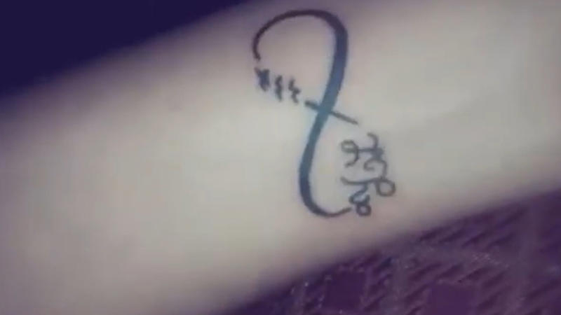1. Dainty Butterfly On Collarbone, 2. Tiny Heart Outline On Wrist, 3. Mini Moon Behind The Ear, 4. Feather On Inner Forearm, 5. Tiny Rose On Finger, 6. Single Star On Ankle, 7. Mini Crown On Nape, 8. Cherry Blossom On Ribcage, 9. Tiny Paw Print On Foot, 10. Dandelion With Blowing Seeds, 11. Angel Wings On The Back Of The Arm, 12. Tiny Script Word On Collarbone, 13. Tiny Rainbow On Wrist, 14. Wine Glass On Hip, 15. Anchor On Side Rib, 16. Music Note Behind The Ear, 17. Lavender Sprig On Arm, 18. Infinity Symbol With Initials, 19. Tiny Mushroom Cluster On Ankle, 20. Cupcake With Cherry On Top On Hip